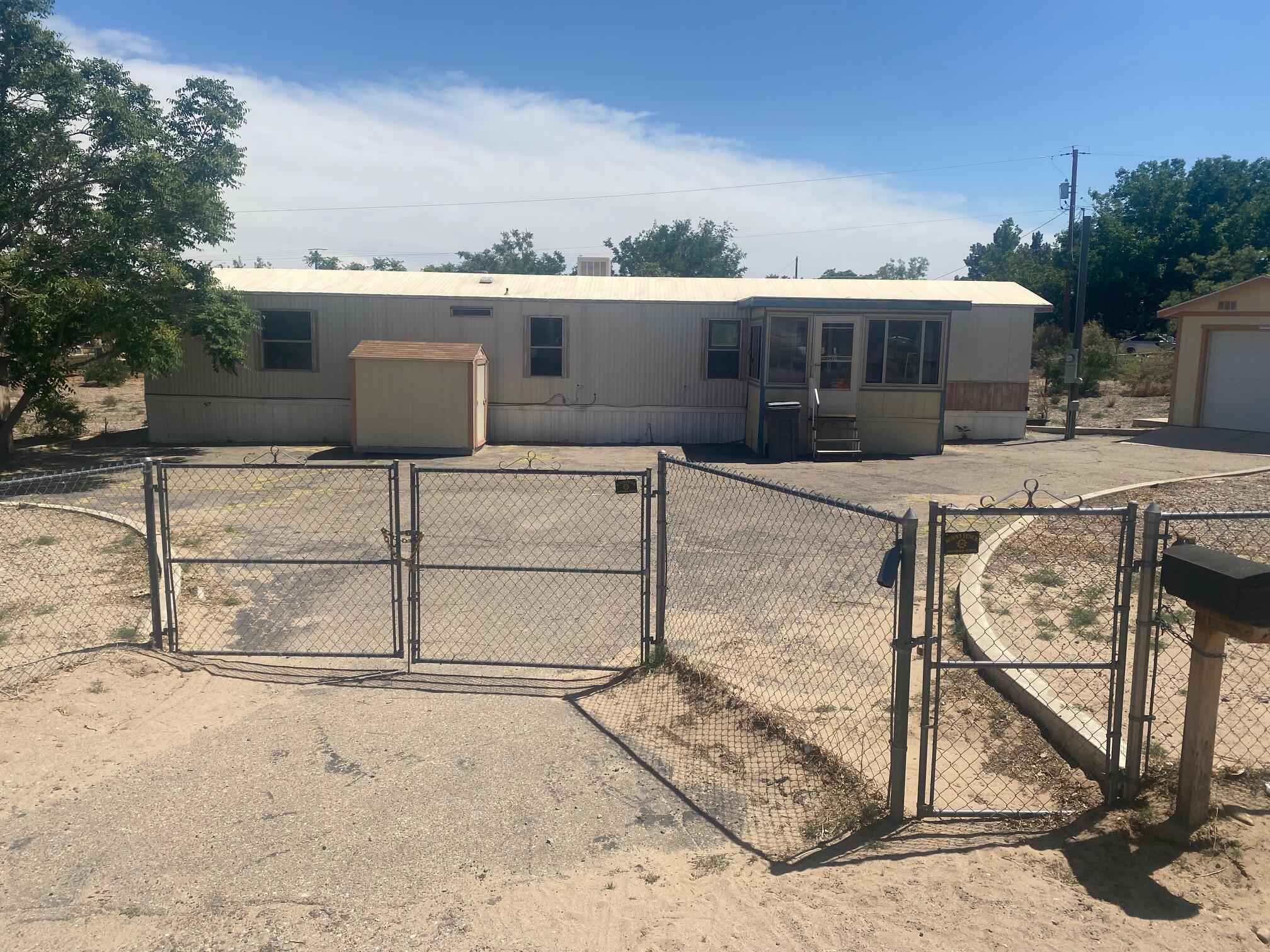 Singlewide moble home, 2 bed 2 bath, fully fenced on a 1/2 acre lot. Home is not on a permanent foundation. Detached  10x20 garage. Home is on a well and propane.