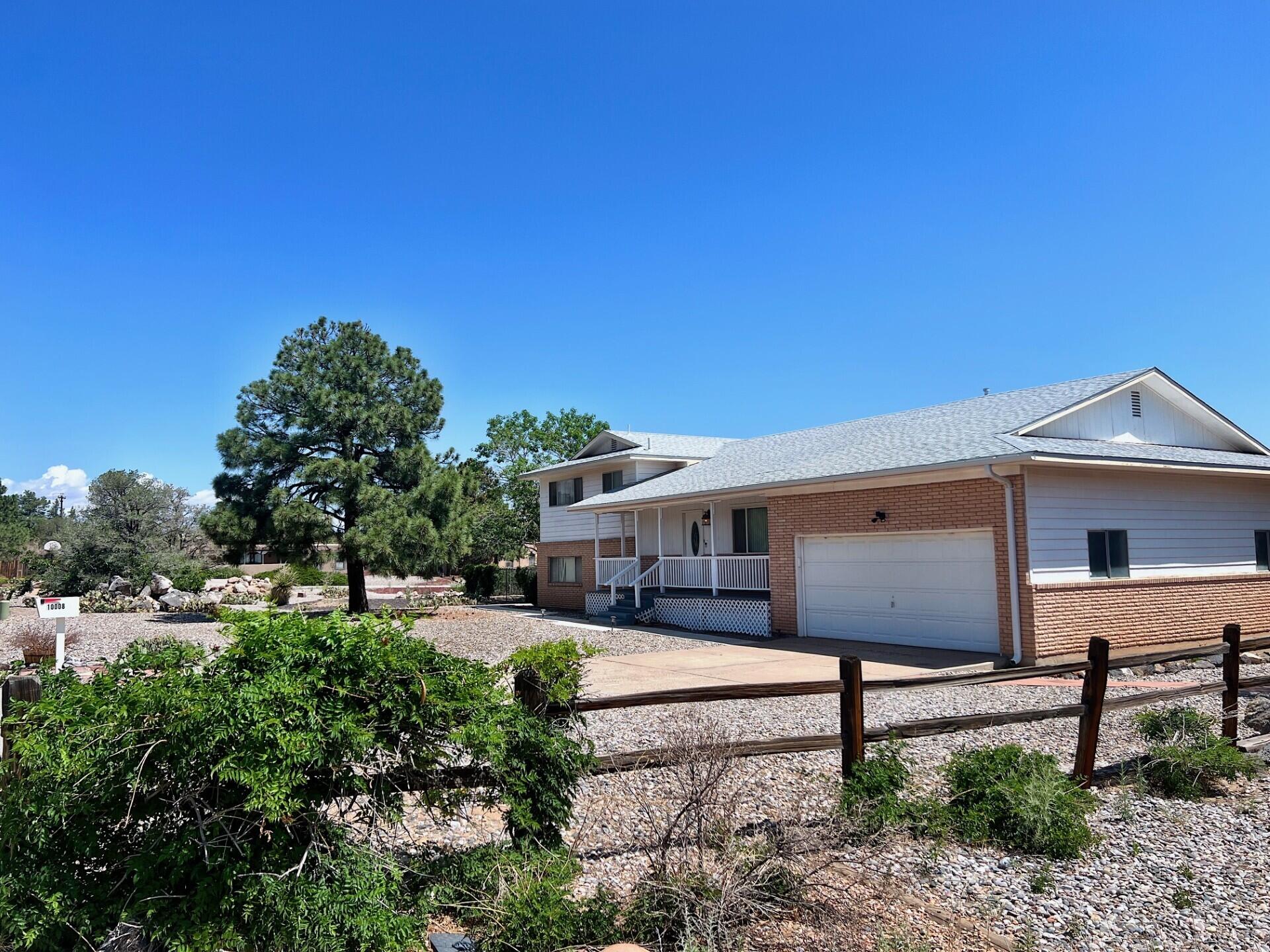 Fantastic ALMOST Half Acre (.47 Acre lot) Property with Awesome Walk-Out Basement! 3700+ square feet, Four Bedrooms ... Wonderful outdoor deck with views of Sandias! This original owner, split level property, has so many versatile spaces, tons of storage options, an oversized 2 car garage and a shed. The huge basement with fireplace has great light from windows and beautiful built-in bookcases, also has access to the awesome backyard full of possibilities!! Recent Electrical panel upgrades and Do Not Miss Those Views :)  If you need space  inside & out ... this one has plenty for all!