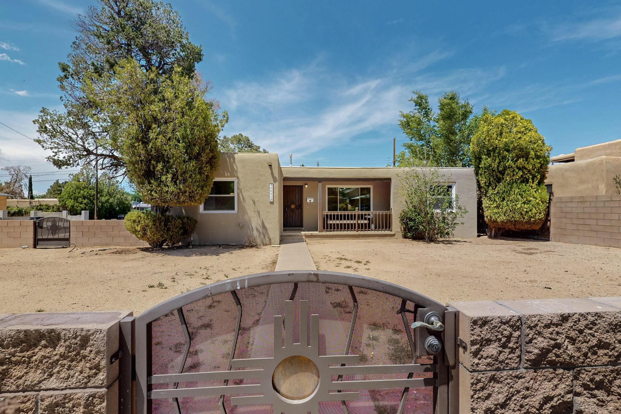 Welcome home! Nestled near UNM and the heart of Nob Hill, this gem puts you just minutes from all the fun--think great food, cool shops, entertainment galore, and even the golf course! Step inside to find a beautiful a completely updated home including a remodeled kitchen that's ready to impress with stunning cabinetry, quartz countertops, and stainless steel appliances. Remodeled bathrooms and flooring.  Two spacious living areas, four generously sized bedrooms, and sunlight pouring in from every angle, this home brings the good vibes. Sitting pretty on a corner lot with a wrap around brick wall and custom gates!  It's got the space, the style, and the location. Come see it before someone else calls it theirs!