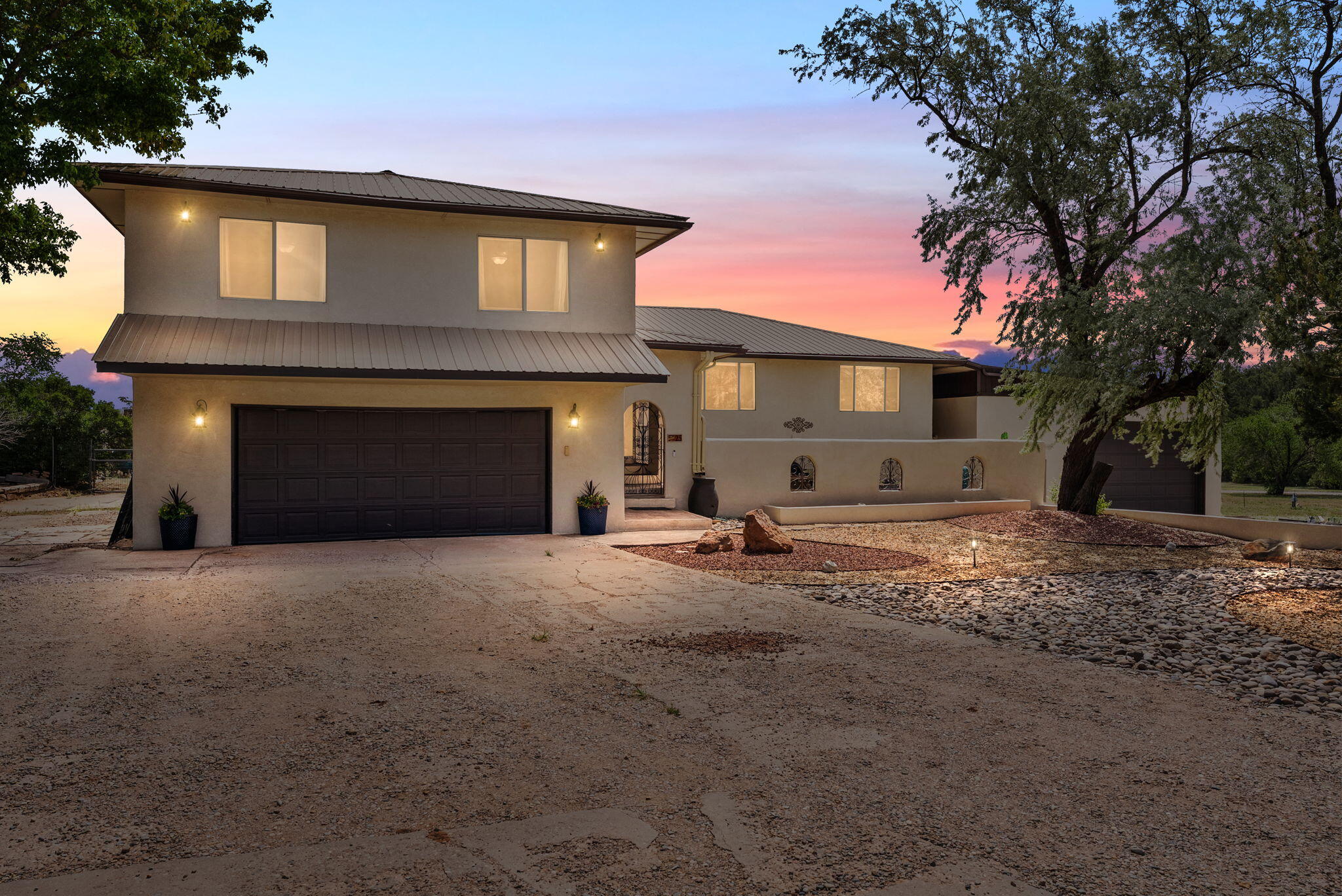 Escape to your own private retreat just 20 minutes from Albuquerque! Nestled on 3.5 acres, this stunning 6-bedroom, 5-bathroom home offers the perfect amount of expansive space. Inside, you'll find a spacious layout that includes a dedicated office, and an impressive bonus garage with ample space to store RVs, or be used as a workshop. The main living areas, including the wet bar, are perfect for both everyday living and entertaining.A unique feature of this property is the attached private suite--complete with its own entrance. Whether you're looking for a guest or in-law suite, a rental opportunity, or a versatile bonus space, this area offers endless potential.Don't miss this one-of-a-kind property with flexible living options, just over the hill from the City!