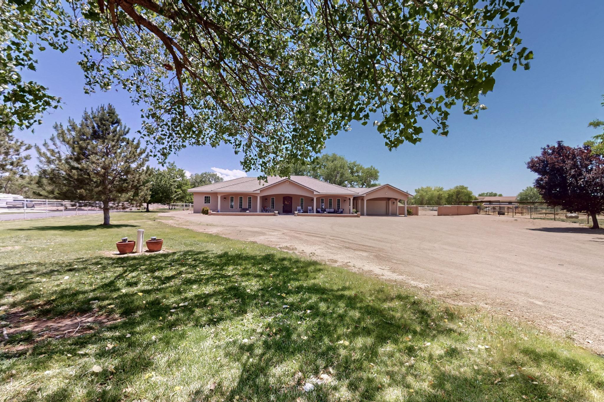 Experience luxury and space in this 4,100 sq ft custom ranch-style home located in Val Verde Estates at West Valley Farms. Situated on 1.414 acres, this stunning property features 10 ft ceilings, two gas fireplaces, formal dining, and an open, flowing layout ideal for entertaining. Double doors lead to a private covered patio perfect for outdoor living. The in-law suite includes a full bath and private entry--great for guests or multigenerational needs. Two refrigerated air units ensure year-round comfort. The oversized garage and large carport offer abundant parking and storage. With quality craftsmanship throughout and room to roam, this home offers elegant country living just minutes from city conveniences.