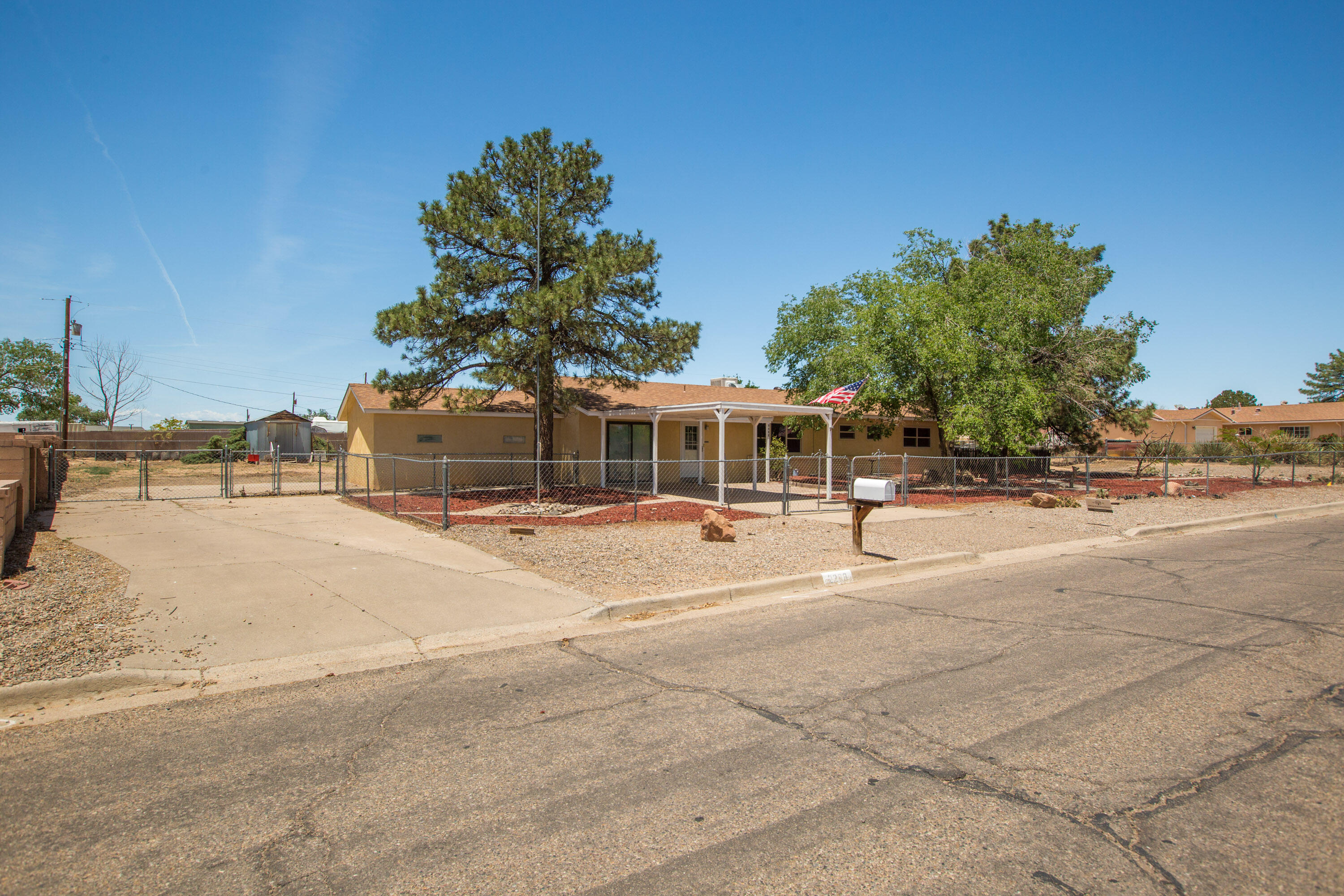 Discover the perfect blend of space and versatility in this 2,580+ sq ft home situated on a generous 0.6-acre lot in Rio Rancho. This property features 3 bedrooms, 2+ bathrooms, and two large living areas--ideal for relaxing or entertaining. A bonus room offers flexibility for a home office, gym, or guest space. The attached shop is perfect for DIY projects, storage, or running a small business. Enjoy the convenience of city water, a septic system, and backyard access with plenty of room for RVs, trailers, or toys. The backyard includes a functional chicken coop and ample space for gardening, outdoor fun, or expanding your dream homestead. Close to many amenities. A rare find with room to grow!
