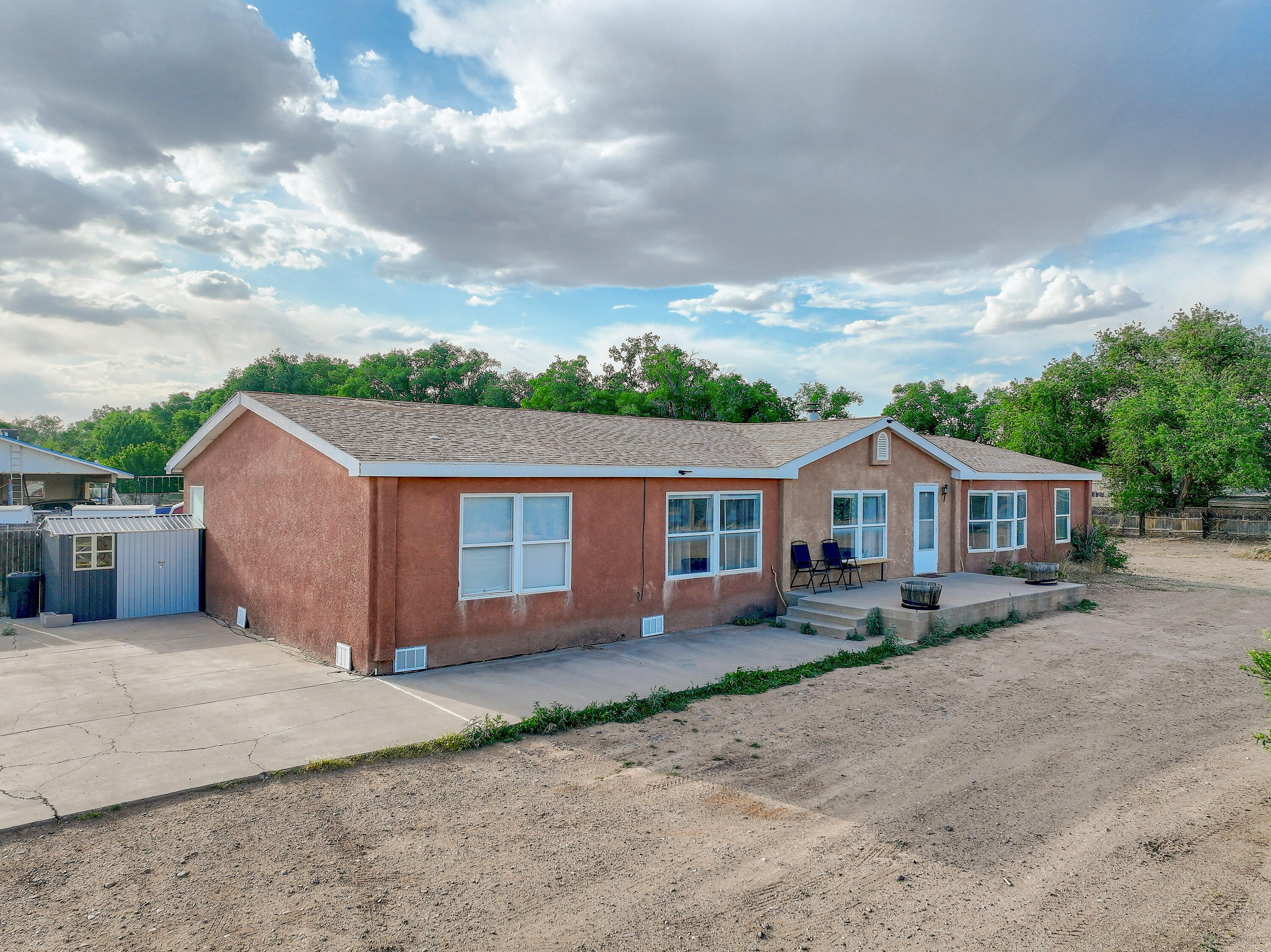 Unique opportunity to live in the North Valley on almost an acre!!. Home is on permanent foundation with four good sized bedrooms and three bathrooms. Home has a large kitchen, big laundry room, open living room with fireplace, Refrigerated air, and a well that is only a few years old. Home needs some work but the potential is huge!!!