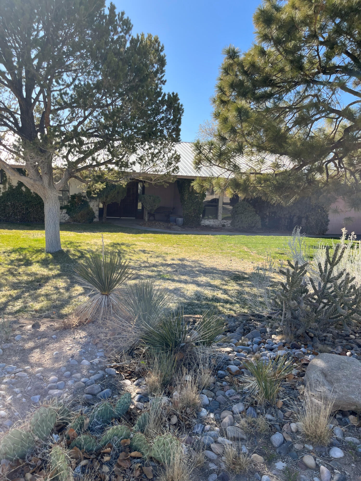 This charming Ranch Style single family home located at 601 C Four Hills Dr SE in Albuquerque, NM was built in 1976 and offers a spacious living area of 3,800 +- sq.ft. The property features 2 bathrooms, 1 half bathroom, and sits on a generous lot size of 1.1+ acres. With a serene and private setting, this home provides ample space for outdoor activities and relaxation. Don't miss out on the opportunity to own this beautiful property in a desirable neighborhood. Equine and off grid potential. Solar Panels and Refrigerated Air conditioning. Almost all furnishings included.