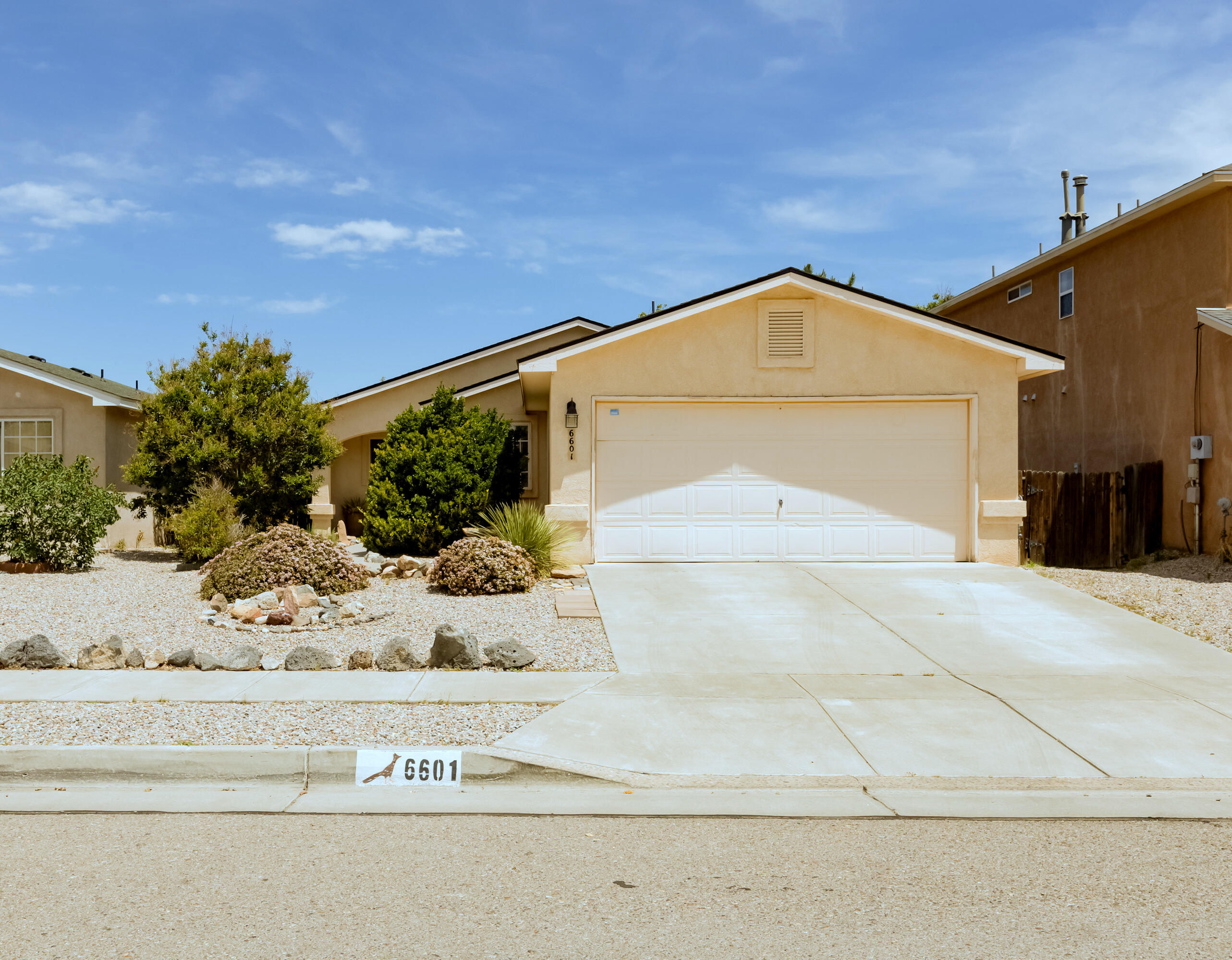 Welcome to this single-story home in a desirable NW neighborhood! Featuring 3 bedrooms, 2 updated bathrooms, and a 2-car garage, this home offers vaulted ceilings and an open floor plan that feels bright and spacious. The kitchen includes all appliances, and the primary suite features a walk-in closet for added convenience. Step outside to a large covered patio, low-maintenance landscaping, and your very own putting green--perfect for relaxing or entertaining. Major updates include a new roof (2022), water heater (2023), evaporative cooler (2019), and refrigerator (2018). Located near parks, shopping, and schools, this move-in-ready home is packed with comfort and value.