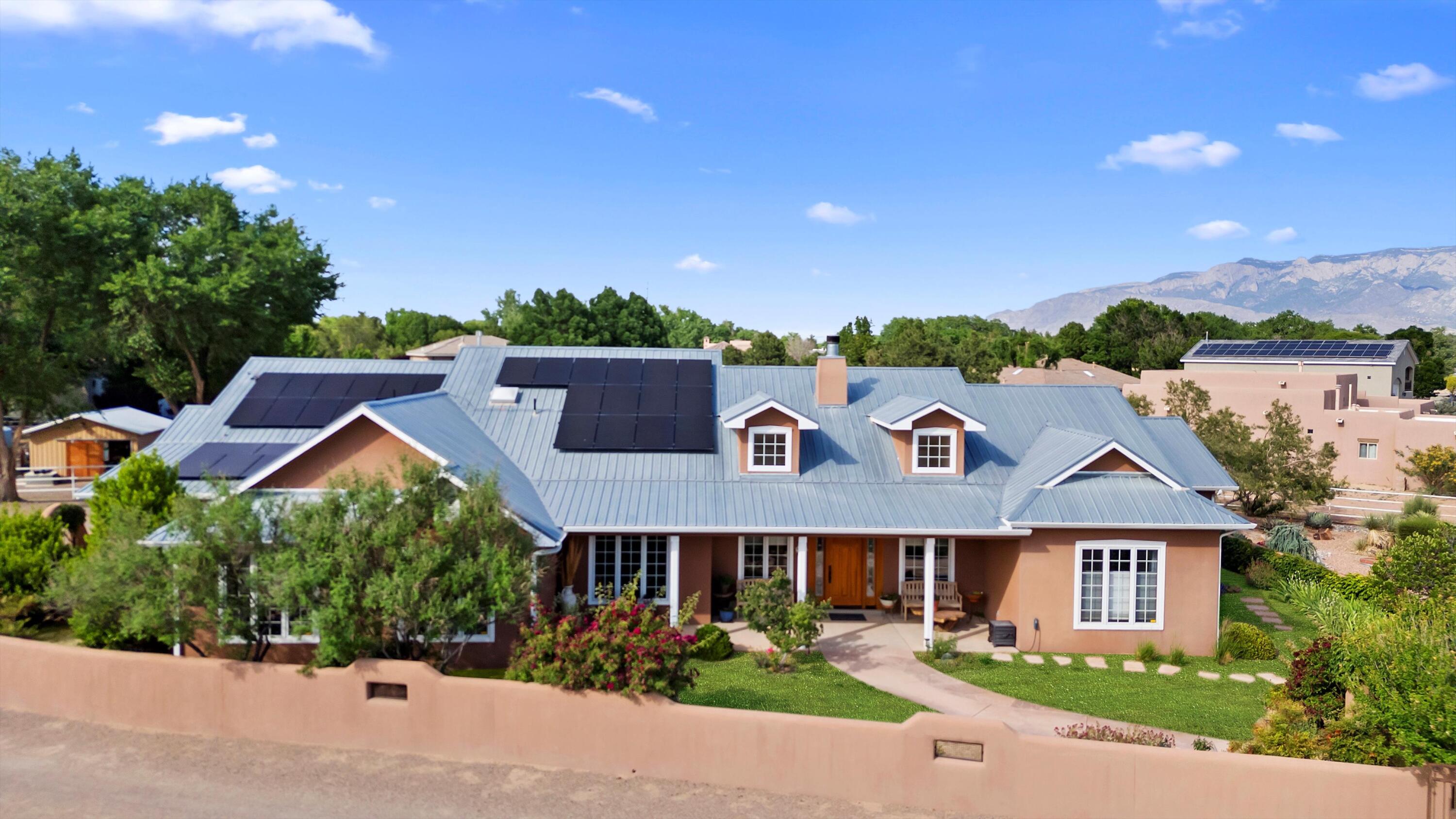 Experience refined desert living in this custom estate, nestled on 1.17 acres of artfully curated gardens and tranquil outdoor spaces. Recently renovated, the main residence blends timeless design with thoughtful upgrades--vaulted ceilings, built-ins, radiant heat, dual ovens, and a stunning remodeled kitchen with custom cabinetry and coffee nook. The fully equipped casita is ADA-compliant and ideal for guests or multigenerational living. Owned solar, deep well, epoxy garage, and extensive landscaping--every detail reflects care. This property is complete with a workshop, greenhouse and fenced in garden area, perfect for your hobbies! A rare blend of privacy, sustainability, and elegance.