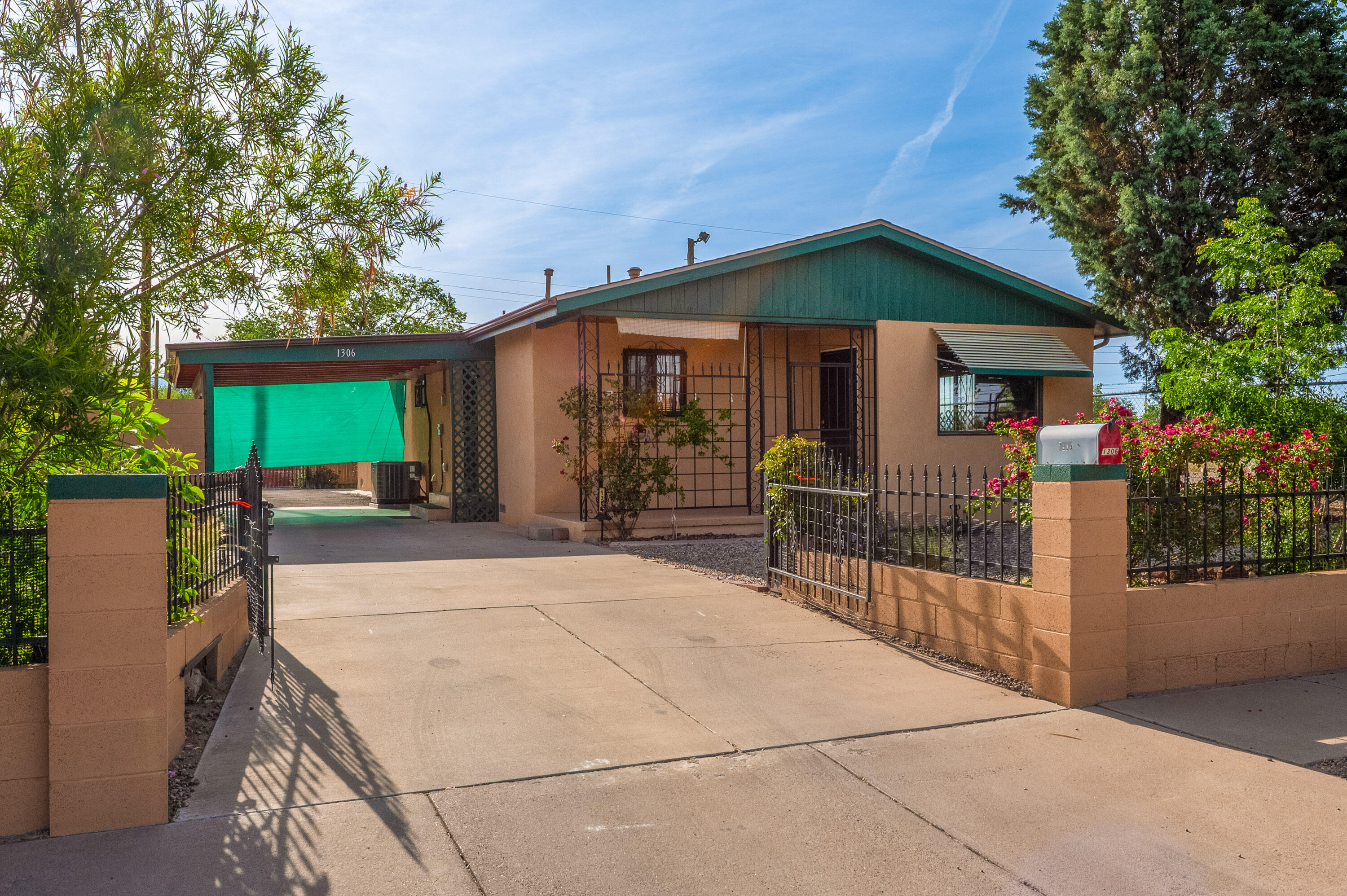 Charming home with a spacious yard and prime North Valley location.  Located in a peaceful cul-de-sac very close to Sawmill Market, Old Town, coffee shops and restaurants, this well maintained 4 bedroom home offers the perfect blend of comfort, convenience, and privacy.  Situated on a large lot with backyard access for an RV, no neighbors on south and east sides,.  This home is perfect for entertaining outdoors.  Plenty of parking for a home-office situation and easy access, just one block from Rio Grande Blvd.  Recent upgrades include new roof, HVAC system, 2024 & water heater 2023.  Granite counter tops in kitchen.  Enjoy the unbeatable location-just blocks from I-40.  A rare opportunity in a convenient location-don't miss it!