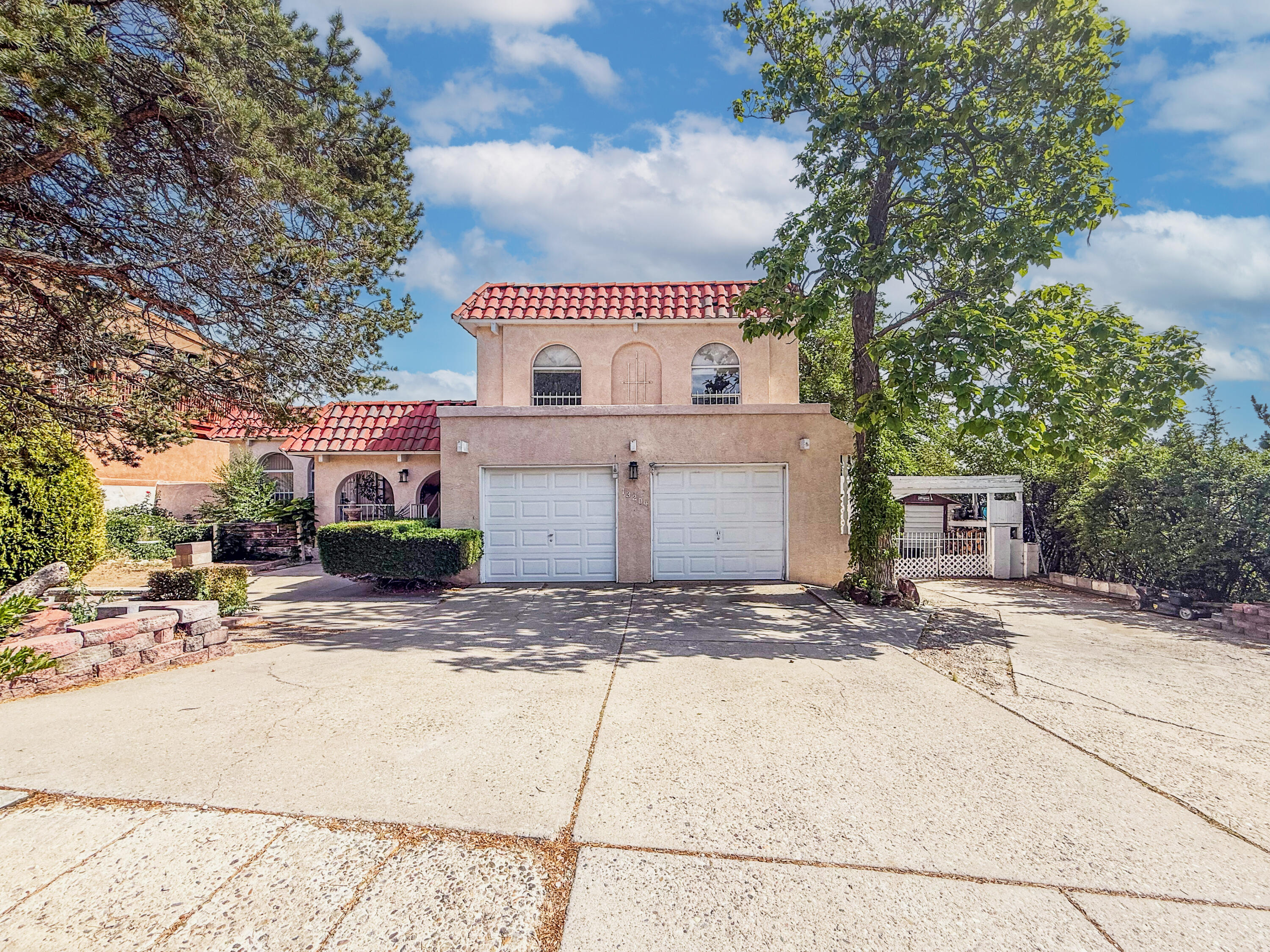 Very well-maintained home located in the prestigious Glenwood Hills neighborhood at the base of the majestic Sandia Mountains.  With 4 well-appointed bedrooms, each with its own unique charm and ample closet space. Refrigerator air to keep you cool in the summertime. With two generous living areas, a formal dining room, and a cozy wood-burning fireplace. Ideal property for entertaining gust by the pool or enjoying the sunrise or sunset dinners on the patio, with direct access to the Sandia Foothills trails, hiking, biking, and nature are quite literally at your doorstep. Whether you're an investor, renovator, or homeowner looking to customize a home this is your chance to create something truly special. Seller will consider owner financing- With Flexible terms!