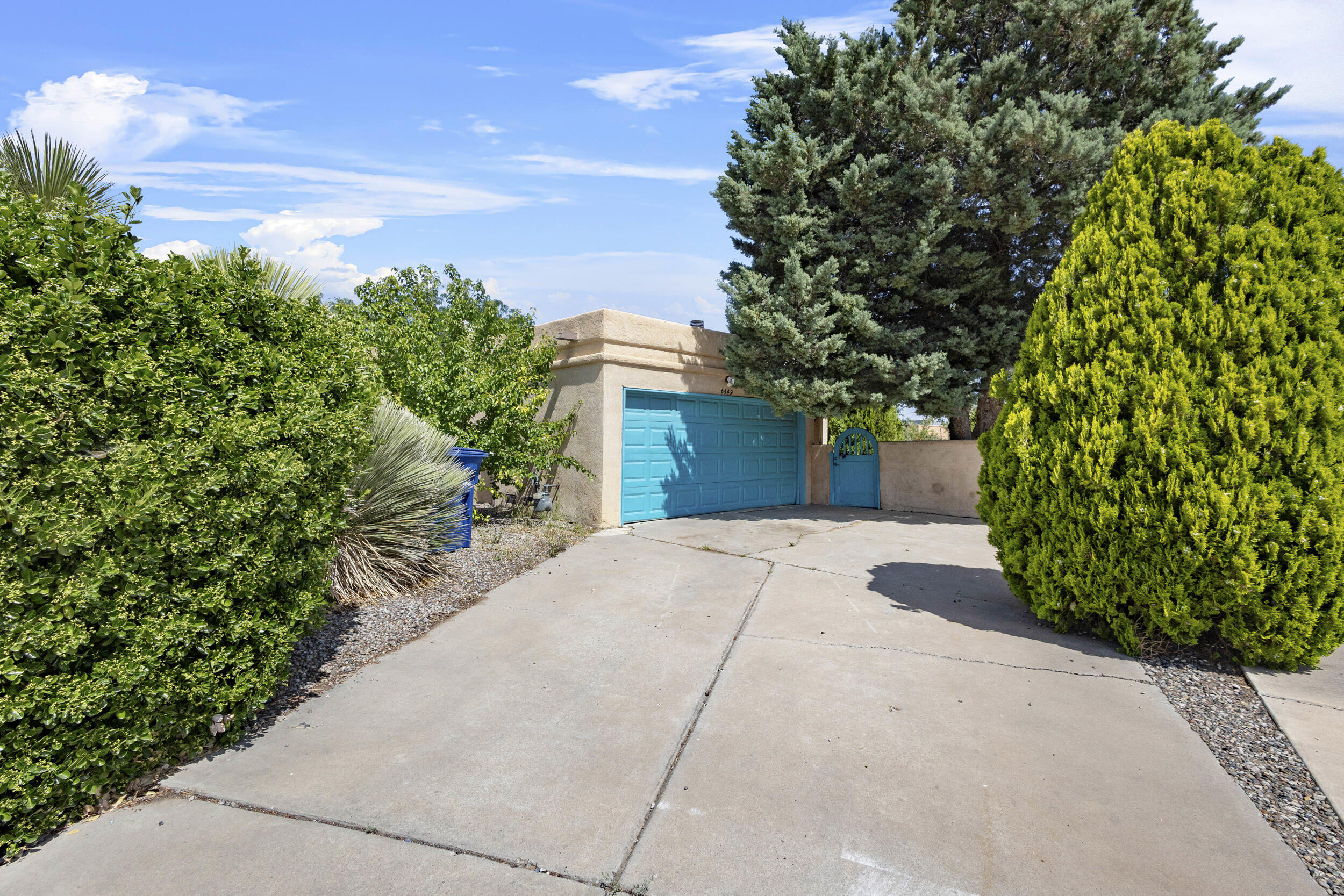 Charming Single-Story Home in a Quiet Cul-de-Sac Near Petroglyph National MonumentThis 2-bed, 2-bath home features an inviting fireplace, bright sunroom, & large windows that fill the space with natural light, creating a warm and welcoming atmosphere.Nestled in a quiet cul-de-sac, this property sits on 0.172 acres, providing a peaceful retreat steps away from Petroglyph National Monument, where you can explore scenic trails & ancient rock carvings.Its large private backyard is fully landscaped with beautiful pines, fruit trees & vibrant flowers. Mature trees provide ample shade, making it a perfect space for relaxation, or gardeningDon't miss this opportunity! With a few updates, this home will become an absolute gem, offering the perfect blend of charm, comfort & location