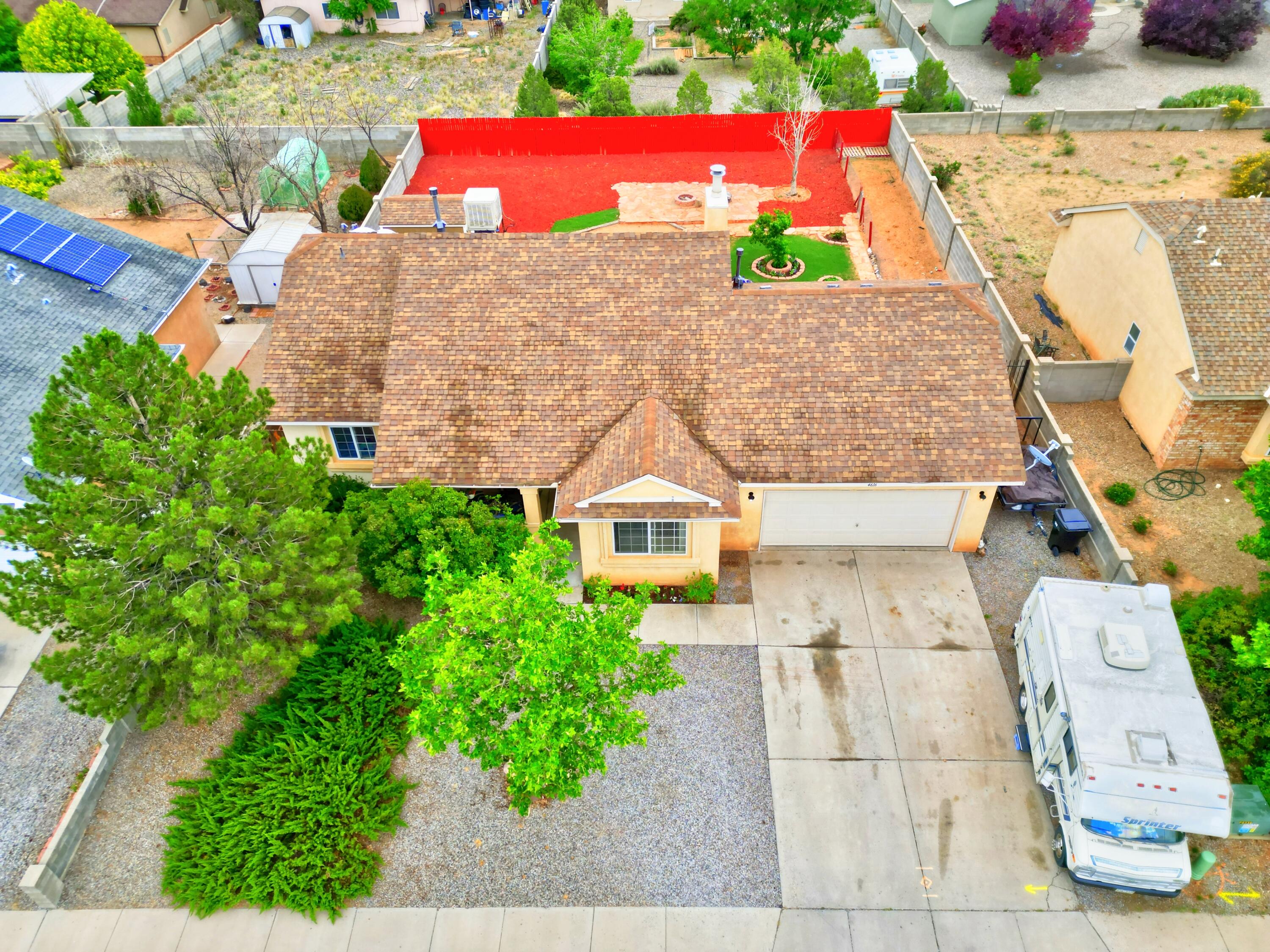 Welcome to this beautifully maintained 4-bedroom, 3-bath home in Enchanted Hills, offering an open floor plan, cathedral ceilings, and breathtaking views of the Sandia Mountains. The spacious living area features a cozy fireplace and flows seamlessly into the dining and kitchen spaces--perfect for entertaining or relaxing at home. Recent updates include a brand-new furnace and a new automatic garage door opener for the attached 2-car garage. Outside, enjoy low-maintenance landscaping and a handy backyard storage shed. Located in a quiet neighborhood with top-rated schools, parks, and shopping nearby, this home is move-in ready and full of charm! **Closing cost credits available**