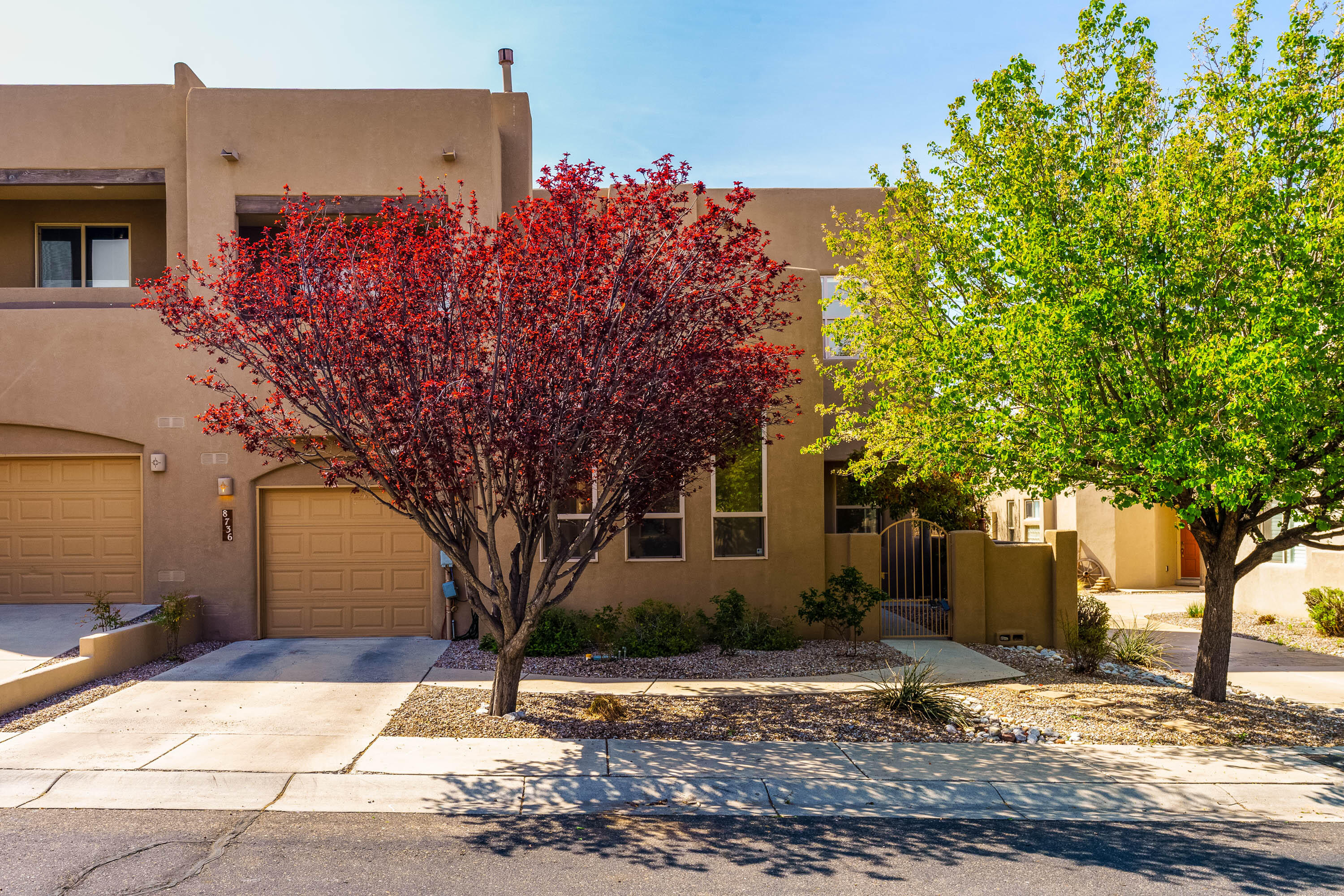 Captivating & charming condo nestled in the peaceful, Desert Ridge Place gated community offering a serene setting w/cherry blossom-lined street. A private courtyard welcomes you, a perfect space for outdoor relaxation. The beautiful great room features soaring tongue-and-groove, beam ceiling, complemented by a cozy gas log fireplace. Large windows fill the space w/abundant natural light, creating a bright & inviting atmosphere. The deluxe kitchen is open to the living area, featuring Corian countertops, tile back splash, gas cook top & an abundance of cabinets. The condo offers two master suites, one of which boasts a private balcony w/beautiful mountain views. The luxurious master bathroom is equipped w/a jetted soaking tub, separate shower, walk-in closet! Ideal location near.. MORE!