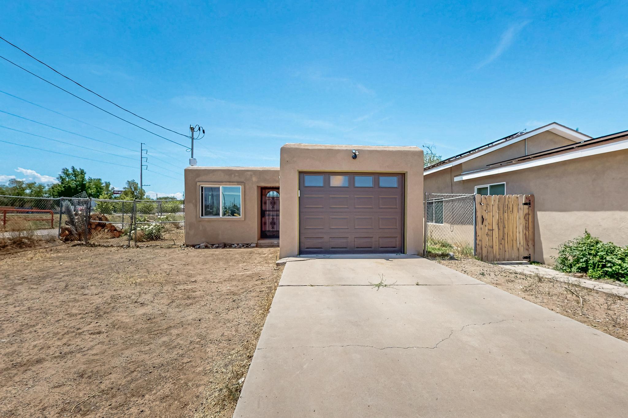 This is a great opportunity to start your own modern Homestead in town. This property currently has fruit trees, rain barrels, fruit bushes, and space for all of your homesteading dreams. The home itself has been tastefully remodeled and updated in 2020, and the current owner has done all of the hard work updating the HVAC and Furnace, adding a new garage door and replacing the sewer line. So this home really is ready for new owners to step in and start making their homeownership dream a reality.  There's even a possibility of building a casita on the back of this property!