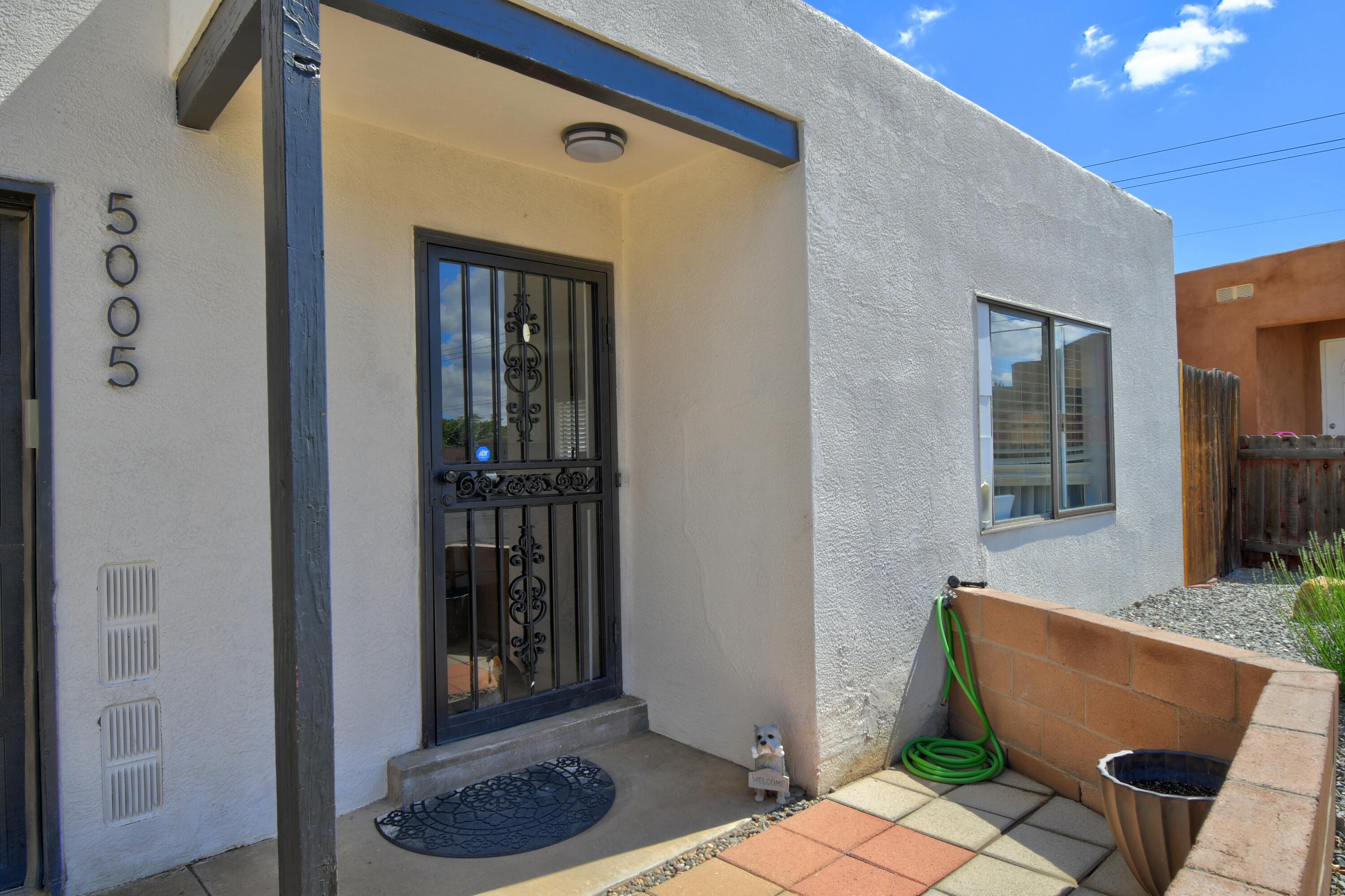 Welcome to 5005 Orion Avenue. This beautifully renovated 2-bedroom, 1-bath townhouse in Northwest Albuquerque is move-in ready and packed with upgrades. Step inside to find luxury vinyl plank flooring throughout no carpet in sight! The modern kitchen features brand-new white cabinetry, quartz countertops, a stylish backsplash, and stainless steel appliances, all centered around a functional kitchen island. Fresh paint and ample closet space make the bedrooms feel bright and inviting, while the fully updated bathroom includes new fixtures, a sleek shower/tub combo, and a contemporary vanity. Outside, enjoy low-maintenance landscaping and a private entrance with charming curb appeal. Don't miss your chance to own this turnkey home in a convenient location schedule your showing today