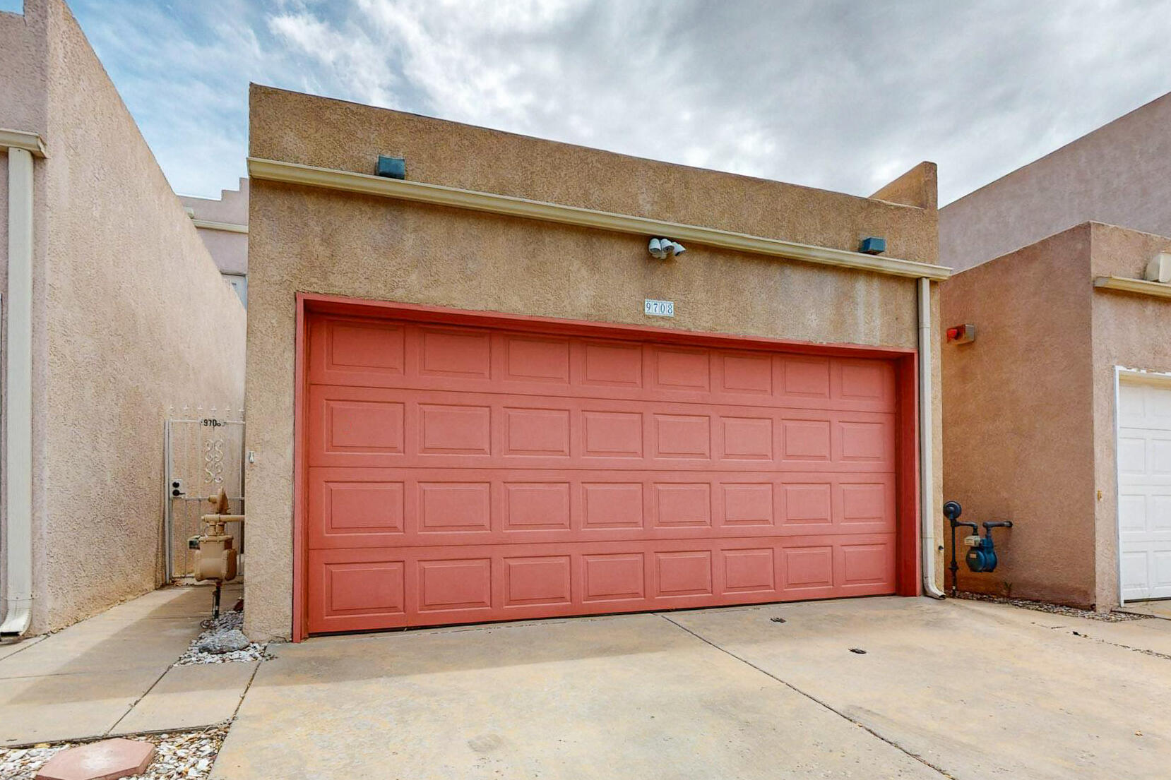 This immaculate townhouse is in a highly desirable area close to shopping, parks, restaurants, and convenient freeway access. The bright and inviting living space features soaring ceilings and abundant natural light.  The galley kitchen is right off the main living area, with space for both formal and casual dining. Great outdoor living with a private front porch, a patio off the living room, and a covered patio off the primary suite.  The home is also prepped for a hot tub if desired.  Two bedrooms share a generous Jack and Jill bathroom, with a beautiful custom-tiled shower. The home boasts ample closet and storage space throughout, and 3 skylights.  A durable TPO roof was installed just a few years ago. Most furniture and washer/dryer are available to stay with the home if desired.