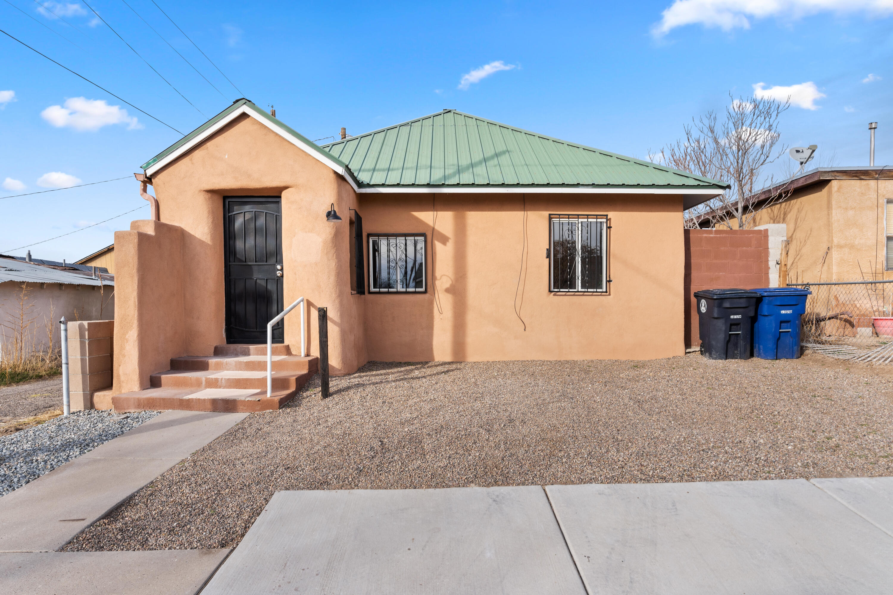 PHOTOS ARE OF HOME BEFORE TENANT MOVED IN, SAME CONDITION! Charming little 1930's Casita is Move in Ready! Located within minutes of UNM, Hospitals & Downtown Albuquerque! This remodeled cutie offers a large living space big enough for a desk or small dining table! One bedroom with lots of storage + ensuite bathroom that shows off remodel with new layout, floors, and shower! Kitchen has an open layout with new cabinets, countertops, backsplash & equipped with gas range + refrigerator! As a bonus you get a laundry room complete with washer + dryer that gives access to the walled in backyard that is fully landscaped. Home also features a metal roof, forced heating, tile floors throughout, new light fixtures, new paint, security wrought iron, and curb cut for off street parking!