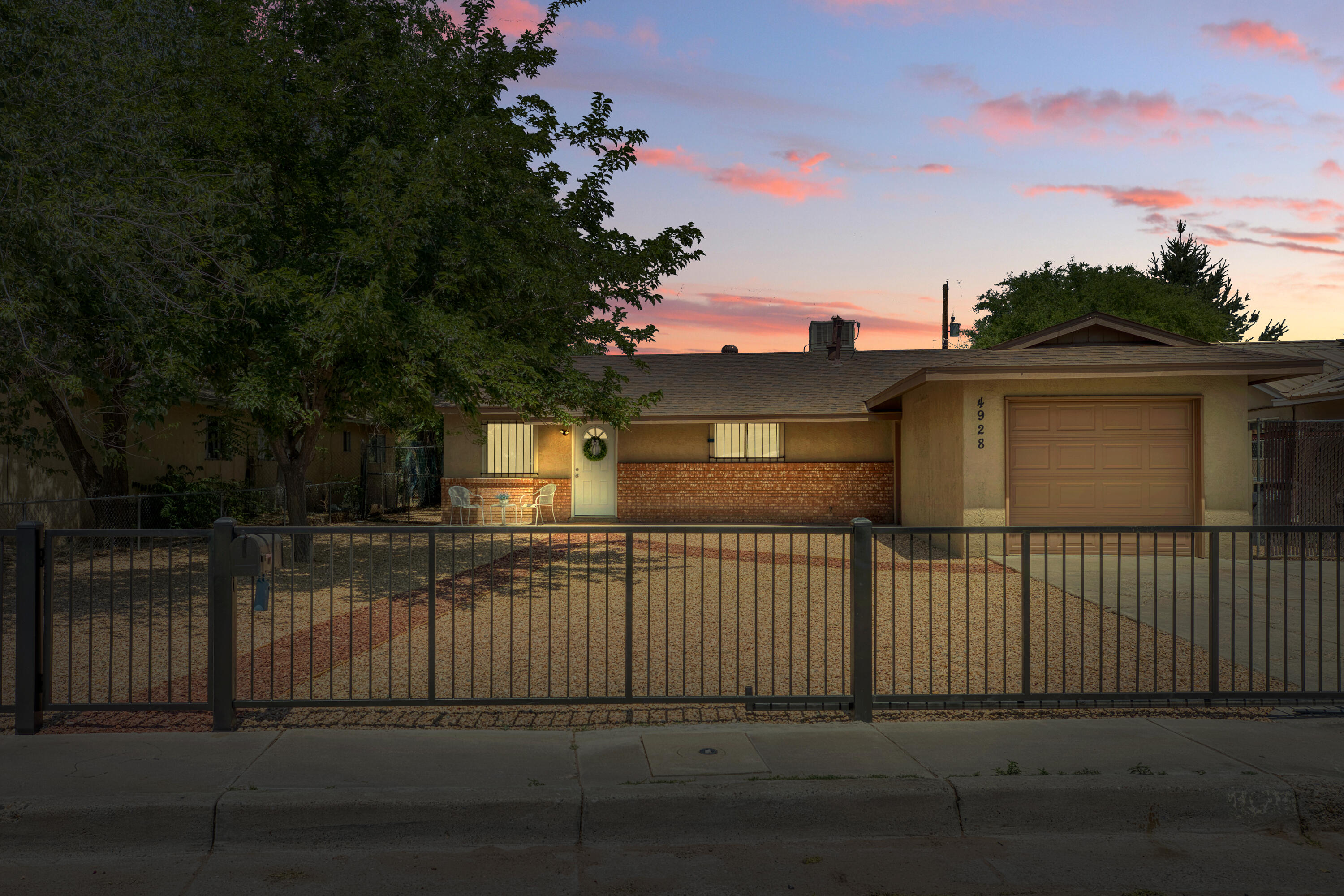 This freshly renovated home offers a warm, move-in-ready feel on a spacious .22-acre lot in a quiet cul-de-sac, with backyard access, mature shade trees, and a gated front yard.Recent updates include new flooring, paint, kitchen finishes, appliances, stucco, refrigerated air, and more. The Roof was replaced in 2021.Gravel landscaping added in front and partially in back. Conveniently located near parks, trails, the ABQ BioPark, and main roads for quick access to daily essentials and recreation.Call today to schedule your showing!