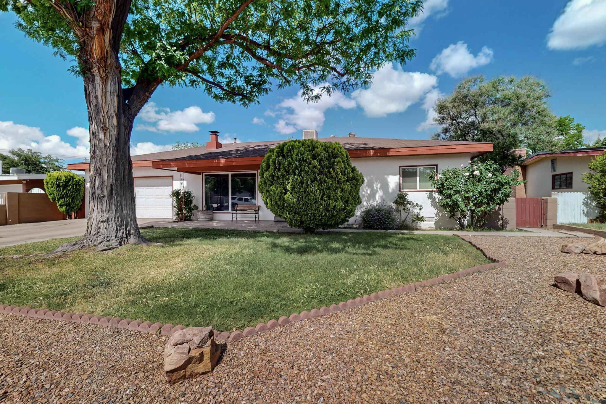 Pride of Ownership! Come and see this charming home in the heart of the city! Original wood flooring, light and bright kitchen with access to the family room and sun room. Three spacious bedrooms with ceiling fans. Two car Garage. Explore and enjoy the front and back yards. Front yard is well shaded with a nice covered entry patio. The large Private backyard boasts many area's for your outdoor needs. A lovely sunroom for your own touch. Come and see this home today!