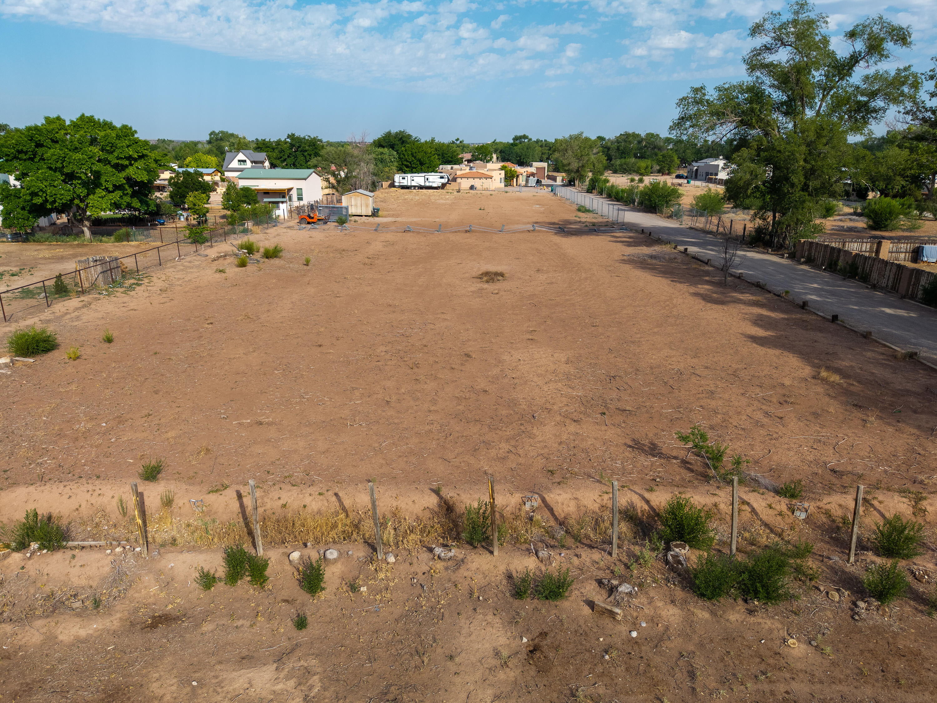Build your dream home on this exceptional nearly one-acre residential lot, perfectly located in the highly sought-after North Valley. Surrounded by mature trees, custom homes, and the charm of country living with city conveniences, this spacious parcel offers the ideal canvas for your vision.Enjoy privacy and tranquility while being just minutes from top-rated schools, shopping, dining, and major roadways. With ample space for a custom residence, gardens, outdoor living, and more, this property provides the flexibility to create a truly personalized retreat.Utilities are located on the property (electric, gas, CABQ water & sewer, telephone), and the lot's level terrain makes for easier development. There is no HOA but some protective covenants for the neighborhood are in place to