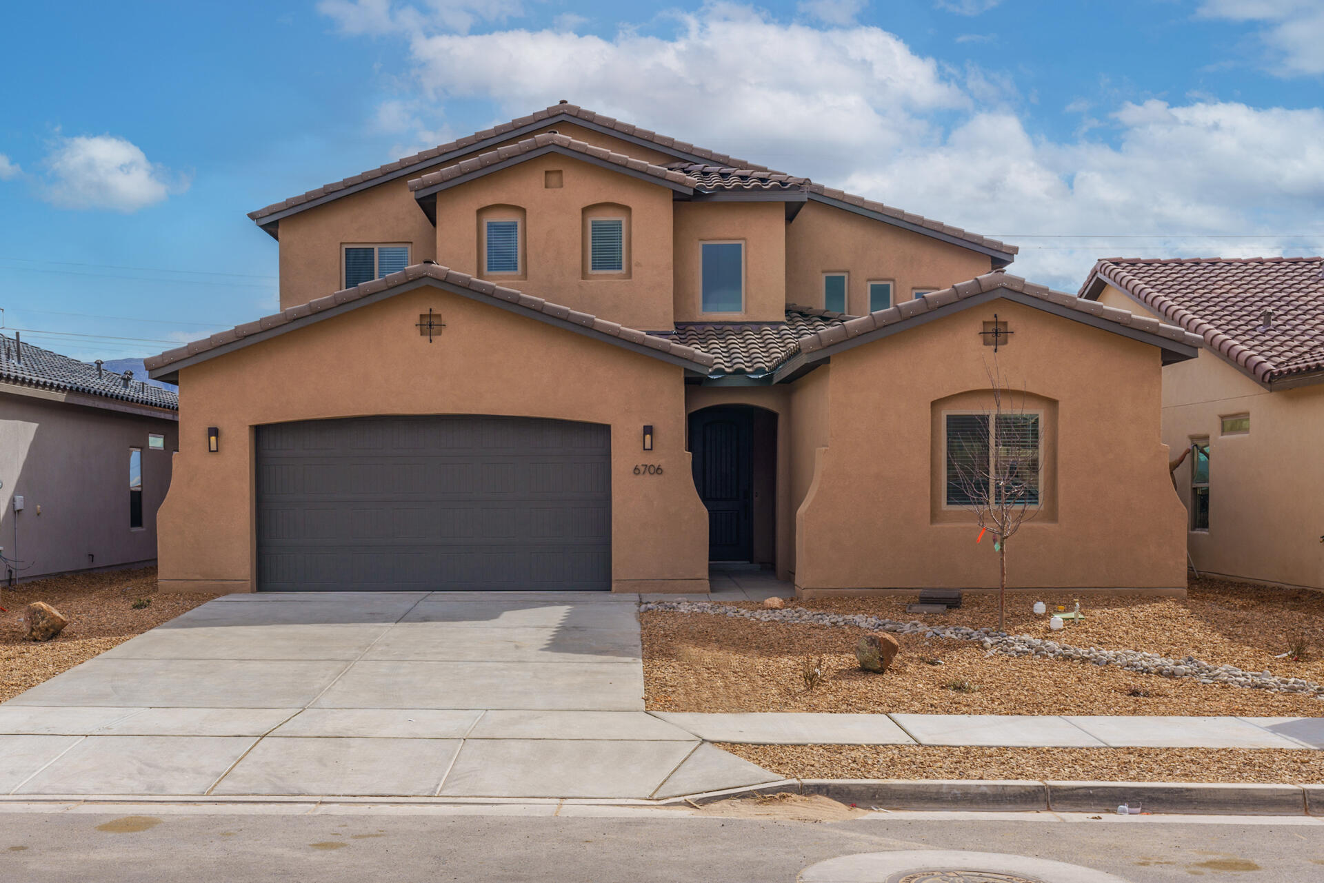 Enjoy breathtaking, preserved views of the Sandias as this home backs up to open space. With beautifully finished wood-look tile floors, an upgraded modern lighting package, a sophisticated fireplace in the great room, and a luxury primary bathroom, every detail has been thoughtfully designed. Don't miss your chance to own a home like no other in the community.