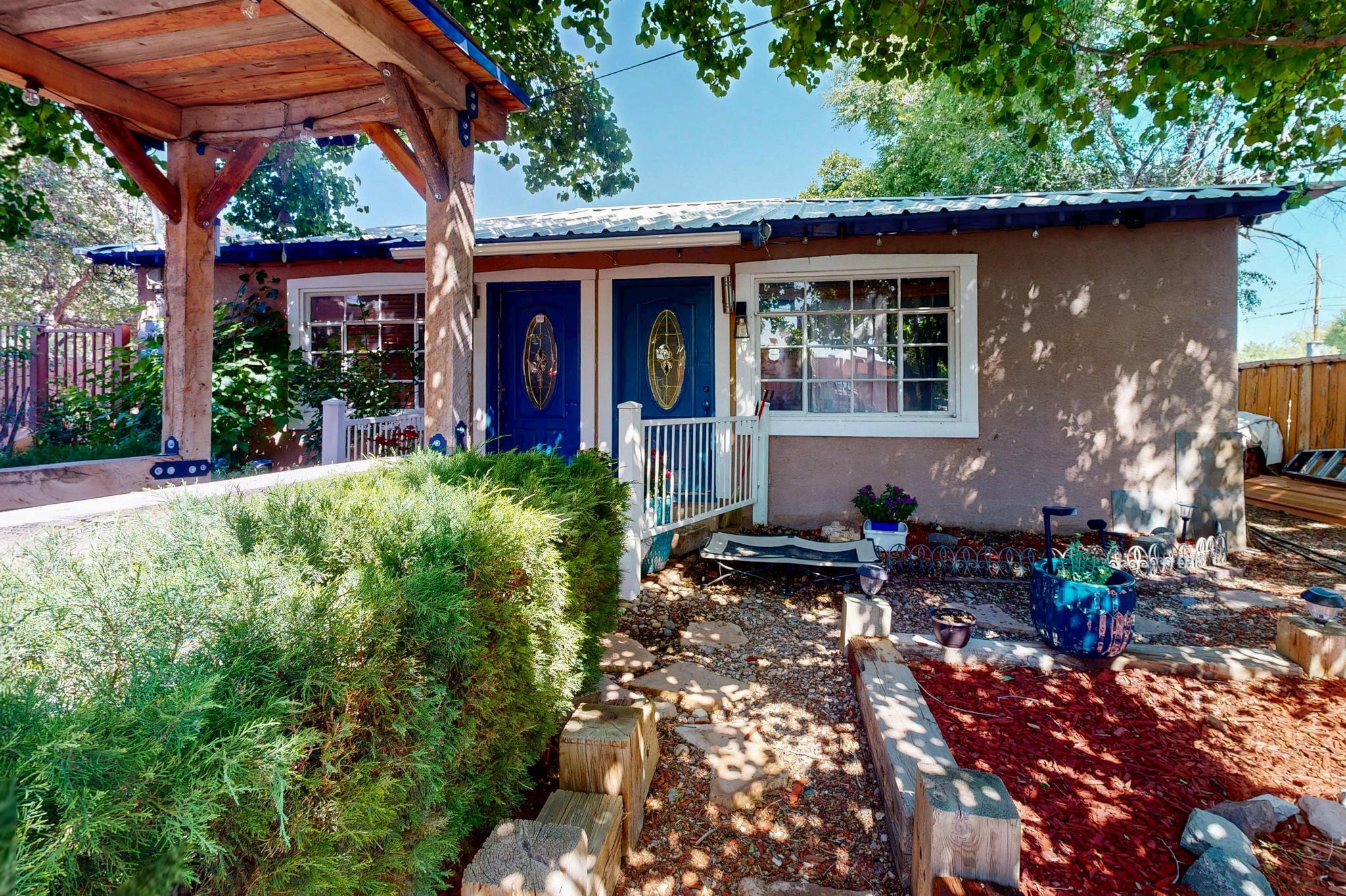 Welcome Home to the Heart of the North Valley! You do not want to miss this Incredible investment opportunity to own a duplex where you can live/work right off Rio Grande Blvd NW. Zoning is for commercial office space and residential. Duplex is situated on a lush lot with identical units. Lot is Fully Fenced, features 6 parking spaces, gorgeous grounds & private patios. Convenient location near Old Town, Downtown, Bosque trails, Nature Center, shopping, parks, schools and so much more! One unit is rented currently at $2,000 a month.