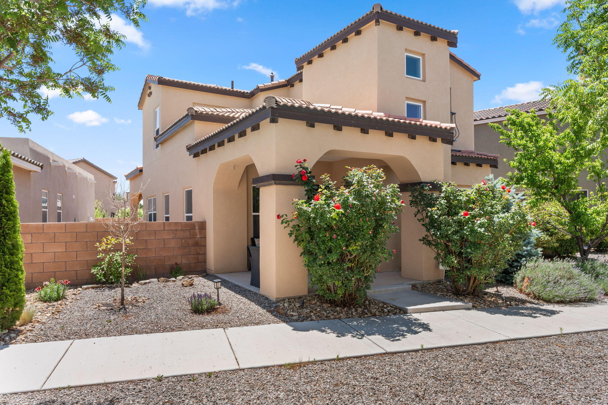 Open House Saturday, June 14th! Move-in ready home in vibrant Mesa del Sol! The main floor features high ceilings, an electric fireplace, and an open-concept living area with great natural light. Versatile layout includes a bedroom and full bath on the main level. The kitchen offers rich cabinetry, ample storage, and a large island for cooking and gathering. Upstairs: the spacious primary suite with ensuite bath, plus two additional bedrooms and a full bath. The landscaped backyard faces east for afternoon shade and includes a covered patio--perfect for relaxing. Enjoy community parks, a dog park, pool just a block away, weekly food trucks, live music, and a local cafe. Ideal for UNM, hospitals, downtown, and airport access.