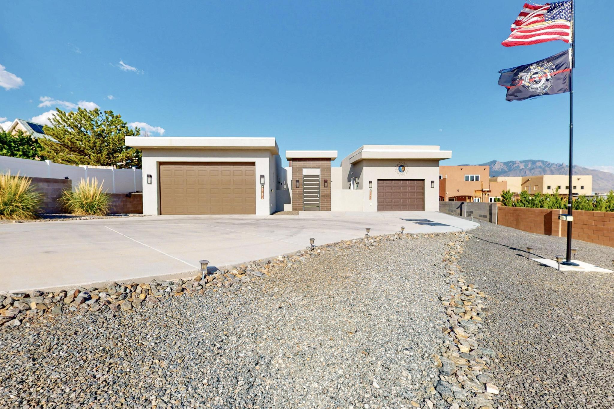 Live your best life in this open and elegant entertainer's dream! This transformed beauty now boasts over 2,800 sq ft of thoughtfully designed living space, including a casita and an incredible garage setup perfect for the auto enthusiast--an oversized two-car on one side and a four-car tandem-style garage on the other. Enjoy maintenance-free landscaping, turf and your own putting green, a rooftop viewing deck, and a covered patio with built-in BBQ and beverage fridge--ideal for gatherings or quiet evenings. Close to schools and shopping, and best of all--no HOA! Every detail invites you to relax, play, and thrive.  See documents for full list of upgrades.