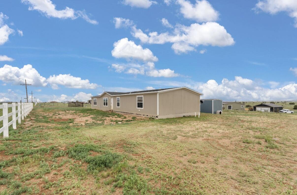 **Welcome to Edgewood, New Mexico!**This home offers stunning views of the Mountain and is situated on 2 acres, featuring 4 bedrooms and 2 bathrooms. Each bedroom includes its own walk-in closet. With two spacious living areas, the layout is perfect for all your needs. The kitchen boasts abundant counter space and a kitchen island, ideal for gourmet cooking. The open dining room flows seamlessly into the second living room and the additional bedrooms.