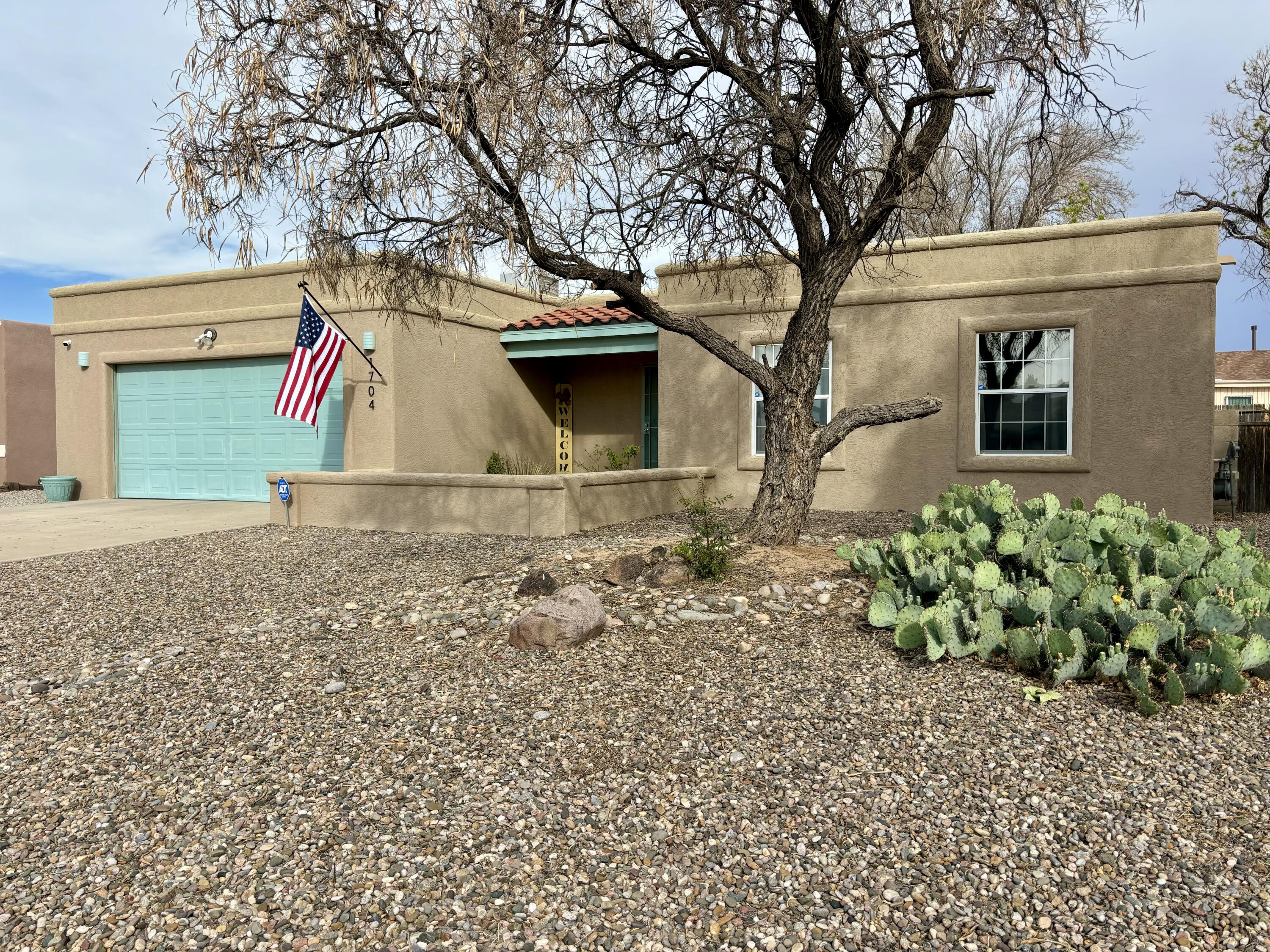 FANTABULOUS Southwestern Styled House with 3 bedrooms and 2 bathrooms.  This BEAUTIFUL home has raised ceilings, skylights, 2-tone paint, luxury laminate vinyl plank flooring, upgraded light fixtures, refrigerated A/C and rubber membrane roof.  It has a HUGE living room with kiva fireplace and access to the covered patio.  GORGEOUS kitchen with granite counters, deep sink,  garden window and pantry.  AWESOME architectural arches in the spacious dining room.  There is an EV plug in the garage.  The large back yard has vehicle access, dog run, shed and terraced for garden.  Located in Tierra Del Sol Golf Course Neighborhood.  If you are a Veteran, qualify to assume the existing low interest rate loan!!