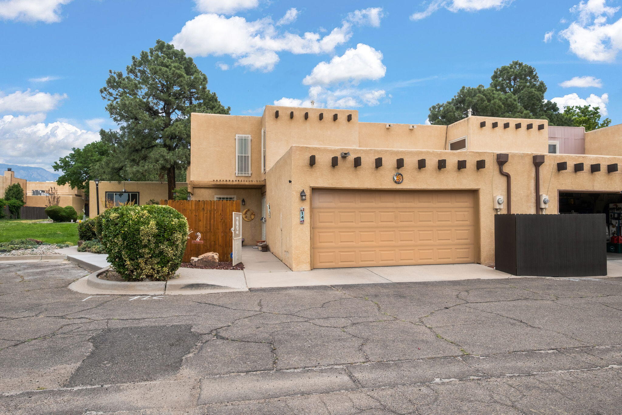 Welcome to your bright, 2-story, end-unit townhome in the Villa Encantada HOA - close to I-25, grocery stores, restaurants, and Arroyo del Oso Golf Course. This unit is situated inside the community, away from main streets. This home is filled with natural light and includes two primary suites upstairs, with refrigerated air providing comfort throughout. Newer Cali Bamboo LVP downstairs and newer carpet upstairs. Additional recent updates include: Rheem water heater (2024), updated bathrooms (2025 & 2019), interior paint (2023), and a refurbished HVAC system (2023).The HOA covers access to the clubhouse and pool, plus some utilities. Low maintenance yards for easy upkeep. Take a look at the full list of updates! Schedule a tour to see in person!