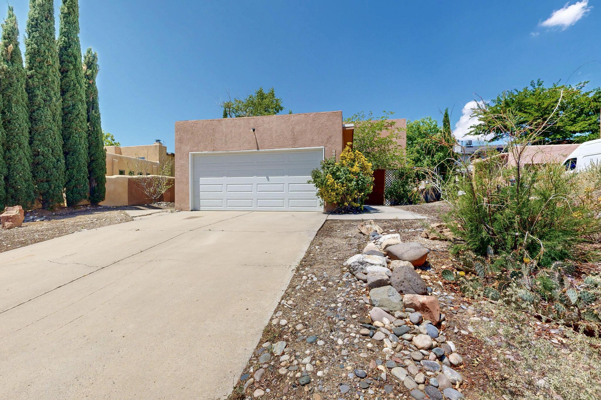 Welcome home! This beautifully landscaped 2 bed/2 bath house is ready for a new owner.  High ceiling in the living room, a Kiva fireplace & saltillo tile. New paint, new water heater, new furnace in 2024, and new fridge, stove and dishwasher. New kitchen cabinets, countertops, faucet and plumbing.  New stucco  in 2021, TPO roof in 2021, well cared for Master Cool swamp cooler and a double insulated garage door.  Two primary bedrooms with full bath.   Both have all new plumbing, toilets, vanities, mirrors, and fixtures.  Upstairs primary has a outdoor deck.   Backyard features a nice shady deck and pergola for your outdoor leisure.  Mature foliage and room to garden.  Full walled backyard.Title prference is Julie Kaltenback with Old Republic Title.