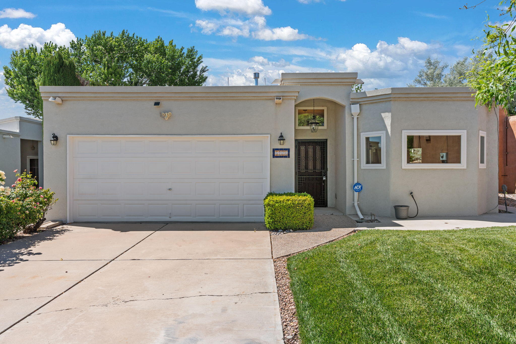 Welcome to 6703 Kelly Ann Road, a meticulously remodeled one story 3-bedroom, 2-bathroom townhome offering unparalleled comfort and style. This home exemplifies a great remodel and pride of ownership, making it a truly perfect ''forever home.''Step inside the dramatic entry and be greeted by a bright and airy open-concept living space with no interior steps. Thoughtfully updated in 2018 with new windows, plumbing fixtures, cabinetry, and designer neutral paints throughout. The living room boasts a raised ceiling, ceiling fans for optimal comfort, a cozy gas fireplace, and convenient built-in cabinetry with a wet bar, perfect for entertaining.The kitchen is a chef's delight, featuring a gas cooktop, stainless steel appliances, and extensive storage.