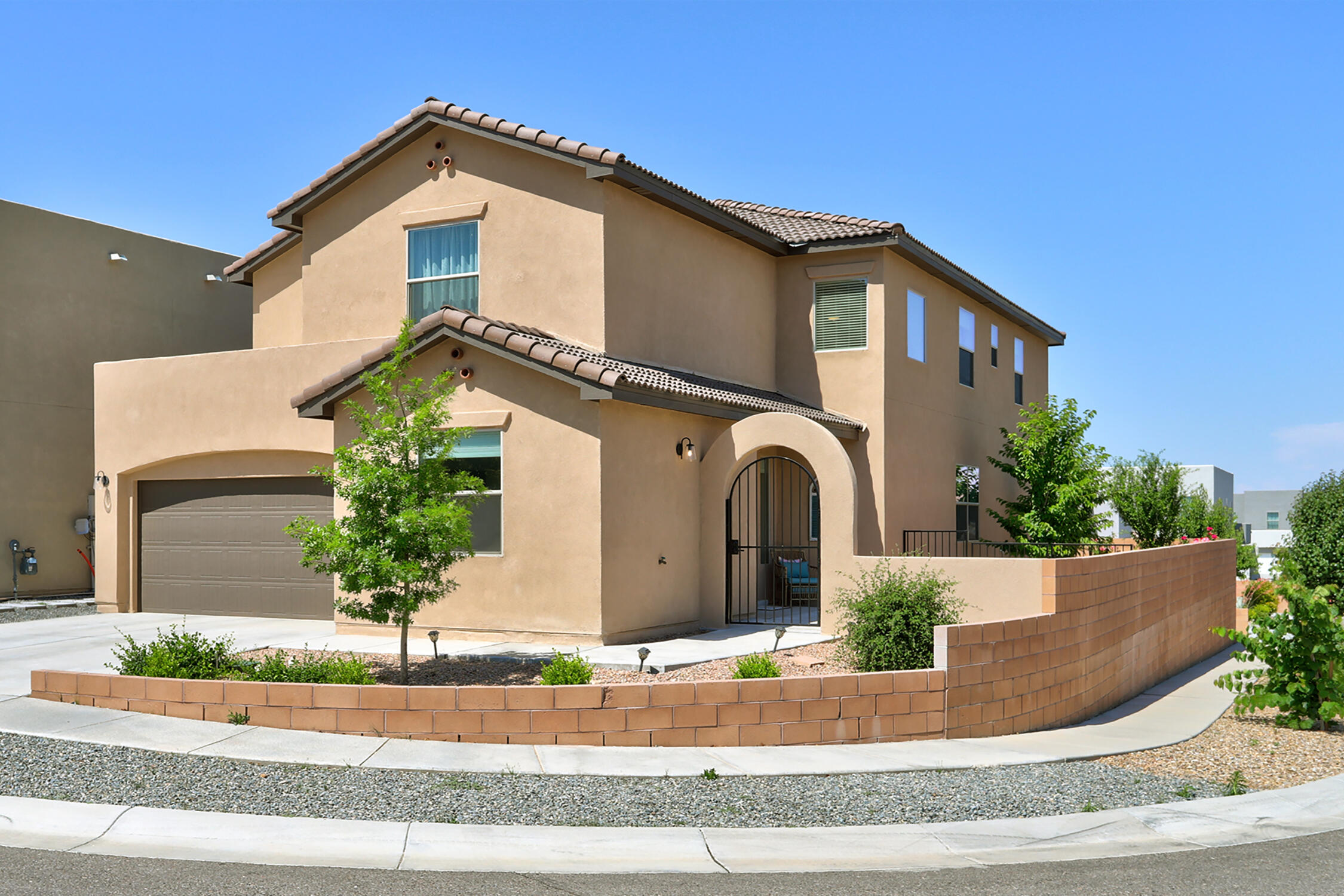 Gorgeous, gated luxury!  The views! Enjoy city & mountain views. Ideally located near shops, dining, I-25 access, Domingo Baca Park & La Cueva HS. Move right into this nearly new stunner--no waiting to build! Brimming with upgrades, from fruit trees in the lush landscaped yard to a versatile layout perfect for multi-gen living. Indulge in the chef's kitchen with a spacious island, 6-burner GE Profile range, and pot filler and amble storage space with walk-in pantry. Upstairs, a grand loft leads to a gorgeous owner's suite complete with spa-like bath and dual vanities plus private view deck. Upstairs laundry for ease, and two additional bedrooms plus full bath completes the upper level.   Sophistication meets comfort--don't miss this gem!