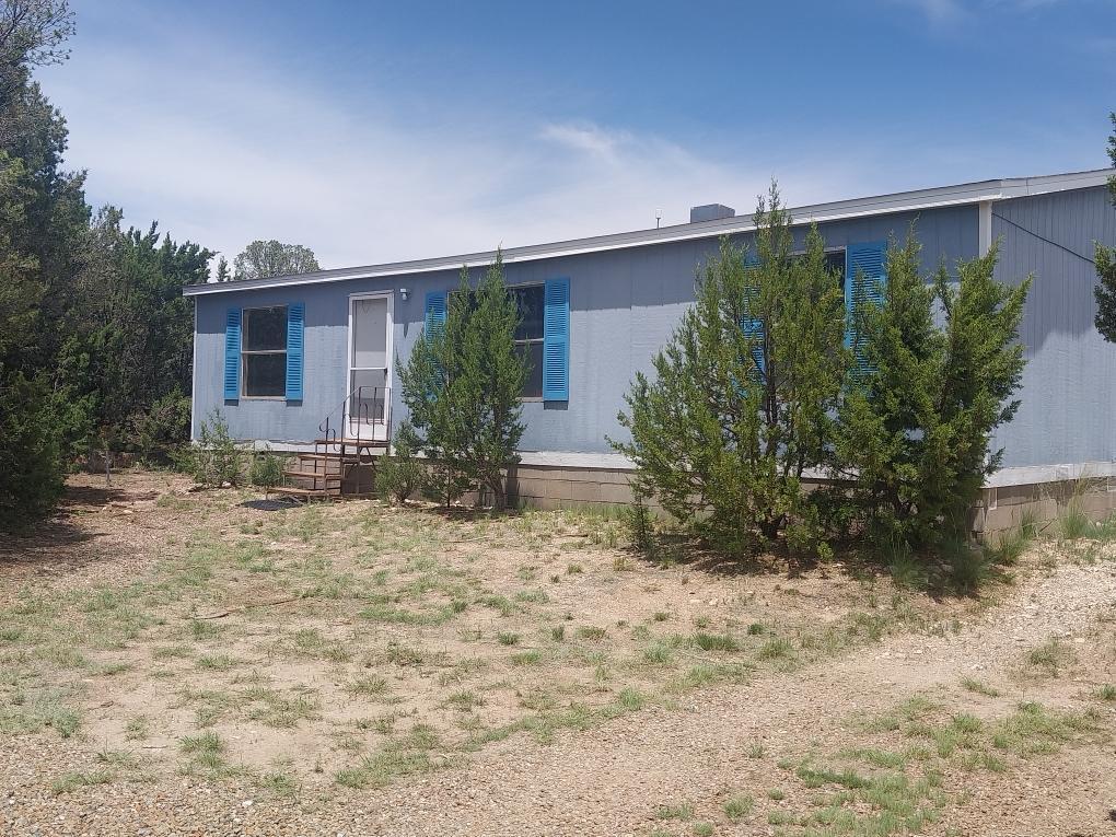 3 bedroom 2 bath doublewide on one acre in beautiful neighborhood south of Edgewood. Native landcape creates blank slate to make it your own. Cleared space for garden, patio, playground or firepit. Heavily wooded for plenty of privacy. Fully fenced. Storage container. Close to Edgewood but far enough for quiet, peacful living.