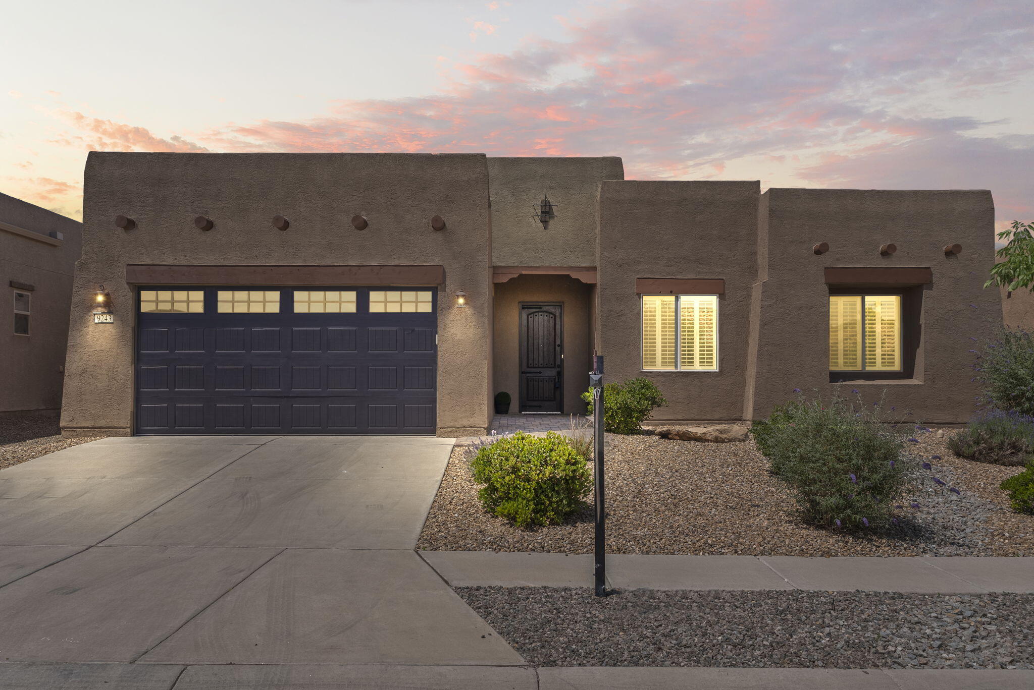 Beautiful Southwest style home nestled in the gated 55+ Del Webb Community! Home features 2,155sf with 2 bedrooms, 2 bathrooms and 2 living spaces. Plantation shutters throughout! Wonderful open floorplan with spacious living area hosting plank tile floors, built-in shelves and a linear fireplace. Chef's kitchen with custom cabinetry, granite countertops, stainless steel built-in oven/ microwave, gas cooktop, fridge, pantry and large island with seating space. 2nd living area with a built in entertainment center and workspace. Owners suite with private bath. Bath hosts, dual vanities, a walk-in shower with glass enclosure and walk-in closet!Fully landscaped backyard with a large covered patio with a fireplace & incredible mountain views! Community pool w/spa, tennis, bocce, pickleball!