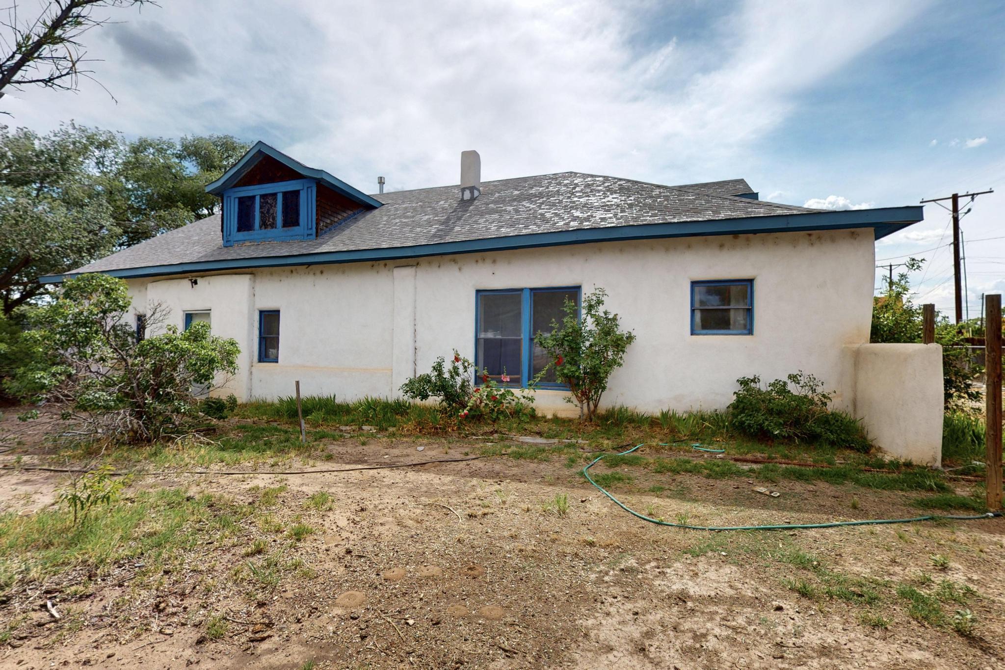 Charming 1-story house in an outstanding location, just a short stroll from Old Town, Sawmill Market, the Botanical Gardens, Zoo, the Rio Grande River Trail, and the Bosque! This 2-bedroom, 1-bath home blends character and comfort with timeless details, including hardwood floors, and a cozy fireplace. The kitchen and spacious living areas create an inviting atmosphere, perfect for relaxing or entertaining. Enjoy the private yard, mature trees, and serene surroundings while being minutes from some of Albuquerque's best cultural and outdoor attractions. A true gem in a vibrant and walkable community!