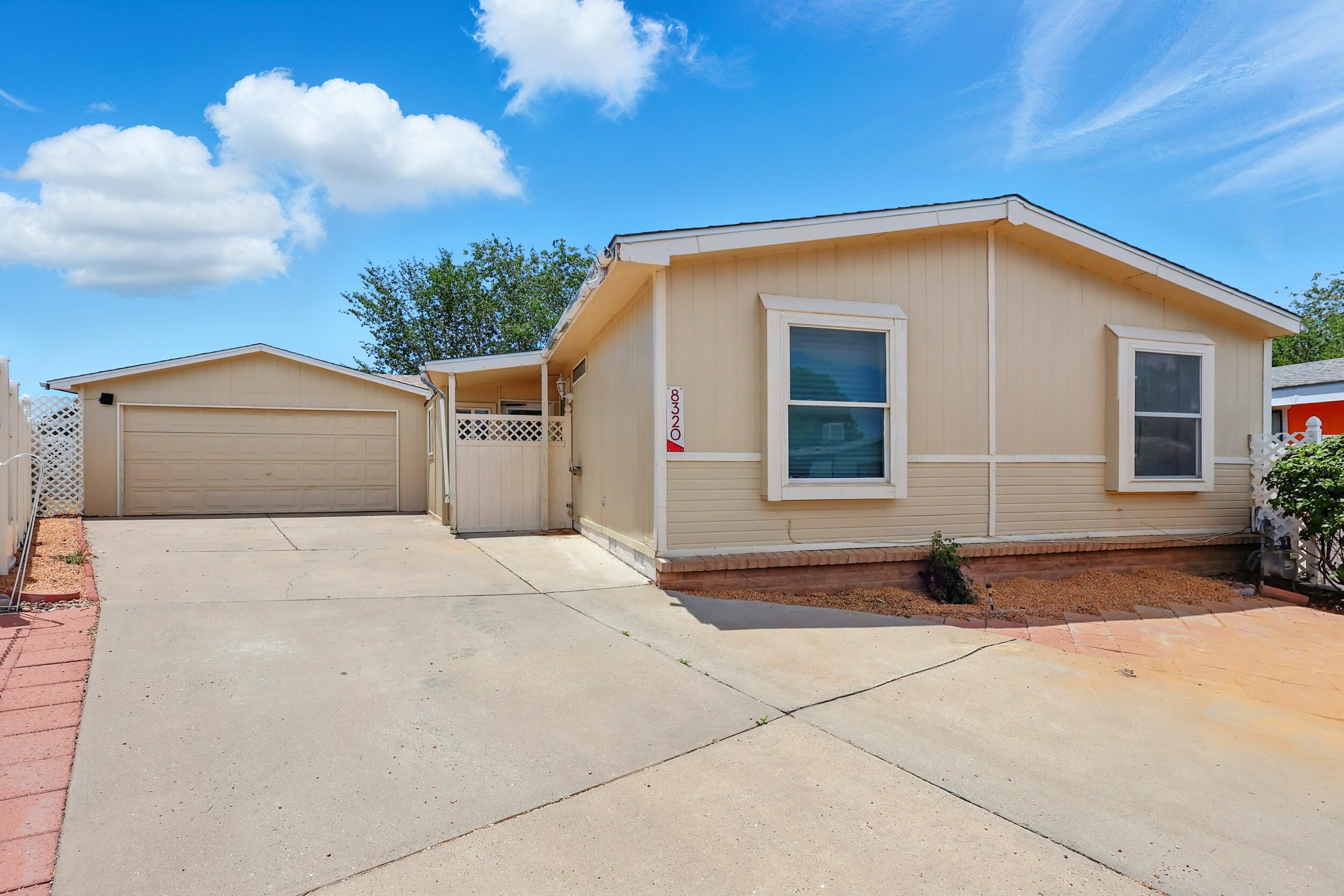 CONVENIENT 3 BDRM with 2 CAR GARAGE! $245,000. Spacious, well maintained home with open floor plan. 3 Bedrooms & 2 Baths, with Primary suite separate from guest bedrooms! Wonderfully convenient location with easy access to I-25 and Balloon Fiesta Park! 1333 sq ft home with vaulted ceilings, large living room open to dining room & kitchen. Newer roof, furnace and refrigerated air! Gas stove in kitchen. Appliances stay, including refrigerator and washer & dryer. No carpet. Bonus 252 sq ft enclosed breezeway between the house & the garage (not included in sq ft). Private backyard. Home is on permanent foundation, so mortgage financing is available! HOA is $160/month and covers water, sewer & trash, as well as the community pool, park, clubhouse & streets.