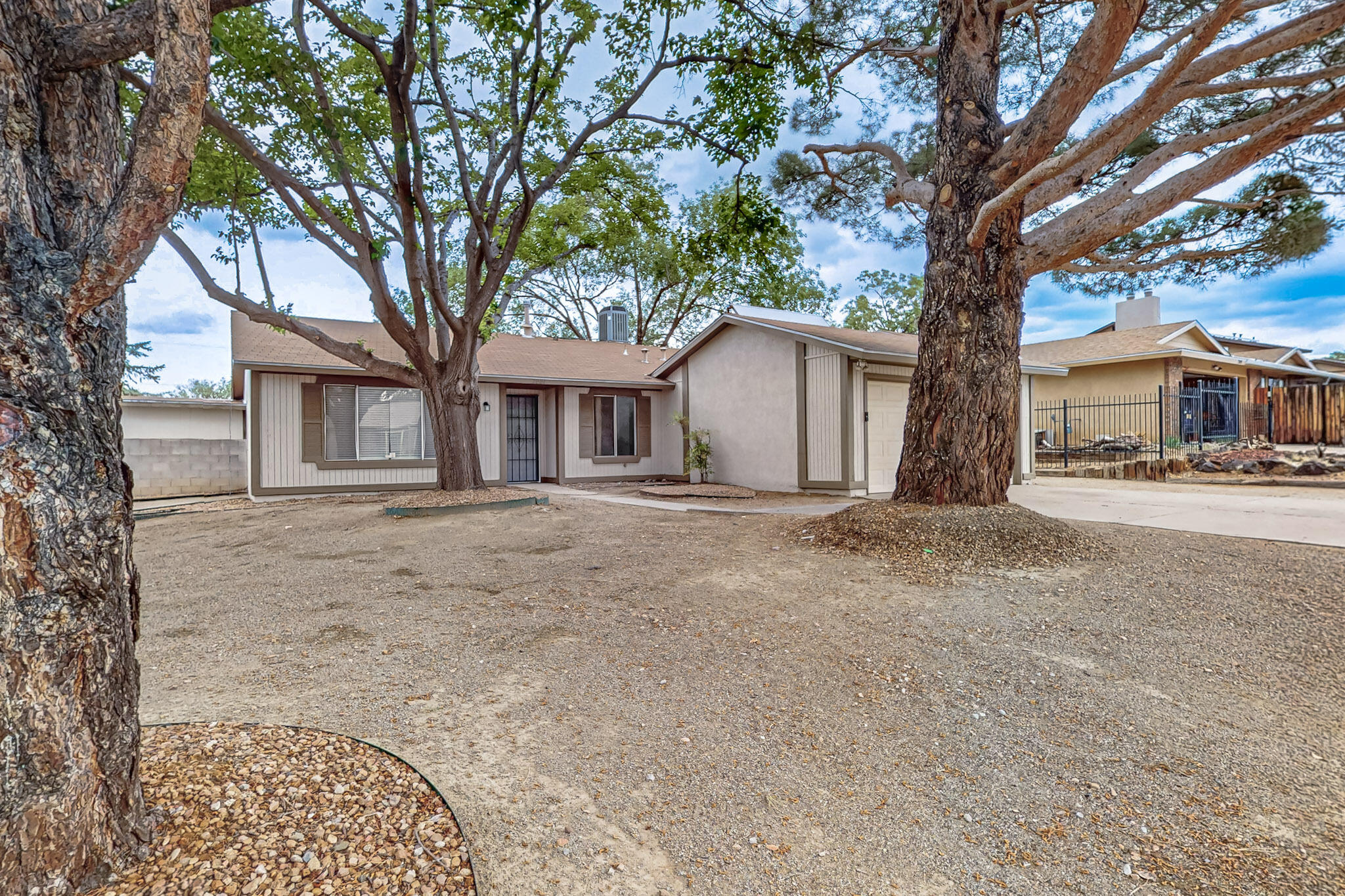 In the desirable Academy Hills Neighborhood! In the heart of NE Heights with access to shopping and minutes away from Arroyo Del Oso golf course. Offering a blend of modern upgrades and comfortable living spaces . This move in ready home has  3 bedroom 2 bath. The open floor plan has much to boast about. The beautiful stone fireplace is great for quiet cozy evenings. The  updated kitchen, has beautiful granite countertops. Both bathrooms have been remodeled with a modern chic look. Updated light fixtures along with Luxury vinyl flooring throughout.  The extra parking is perfect for your needs. Don't miss out on this opportunity!