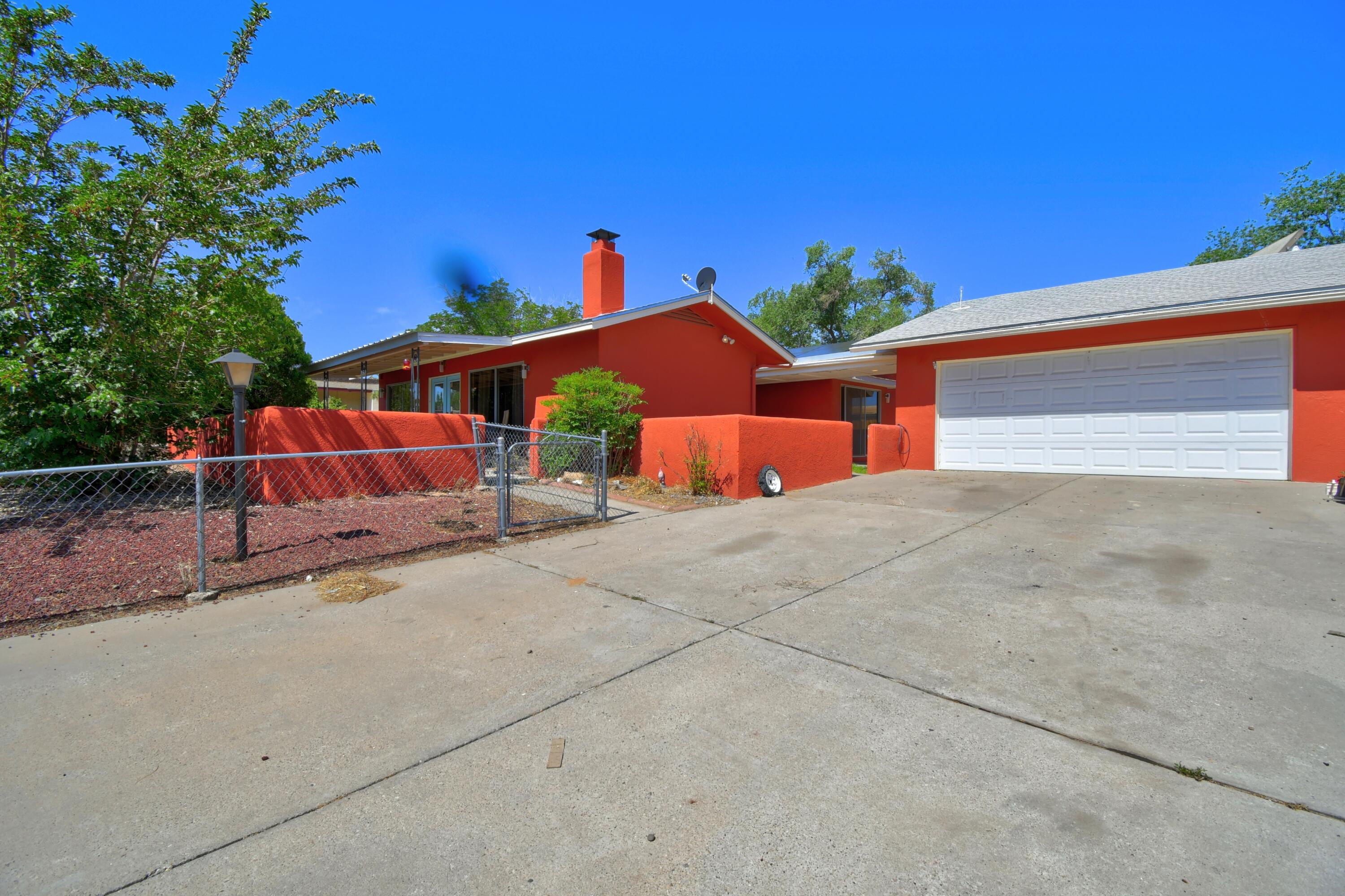 This 3 Bedroom home is located on a large corner lot, across the street from Rio Rancho Elementary.  Home features a large living/dining room combo with a kiva fireplace.  The updated kitchen features stainless steel appliances and a large sink. No carpet here! All tile floors. Detached 2 car garage, has a heated room in the back that can be used as storage or a home office away from the main home.  Home also features solar panels that are less than 2 years old. All appliances convey.  Schedule your showing today!!