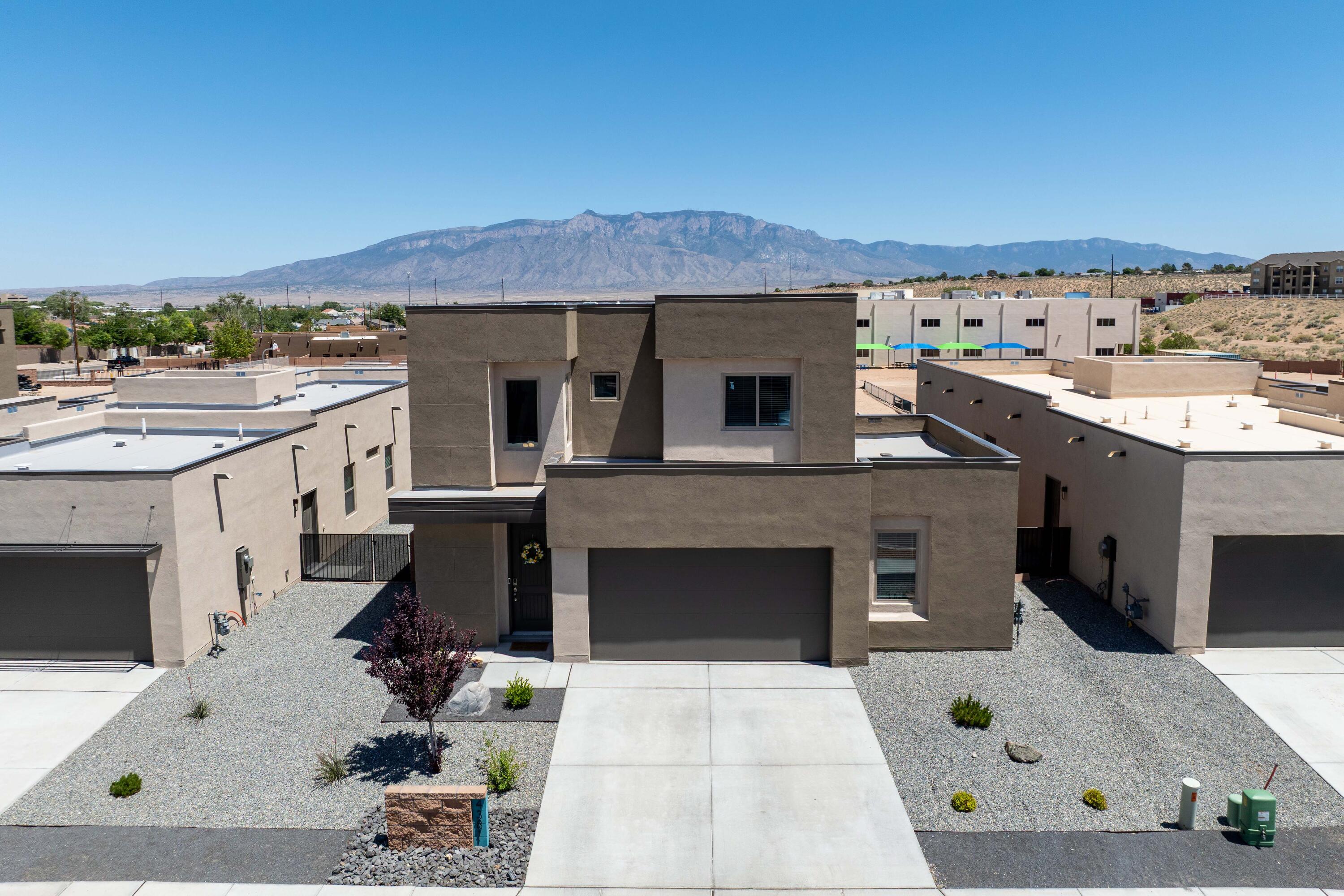 Luxury meets functionality in this stunning newly built home of the new Las Residencias community. This exquisite 3Bed, 3Bath home featuring a spacious private office and breathtaking Sandia Mountain views. The main suite offers a luxurious retreat with Sandia views from your private balcony, spa-inspired bath, and walk-in closet. A chef's dream kitchen awaits with grand island, extended cabinetry, a walk-in pantry, and upscale finishes. Upstairs, a large loft provides the perfect space for bonus living or entertaining. Low-maintenance, beautifully landscaped yard ready to make this home your private retreat. Designed for both elegance and comfort, this home blends thoughtful design with unmatched scenery--your ideal New Mexico sanctuary.