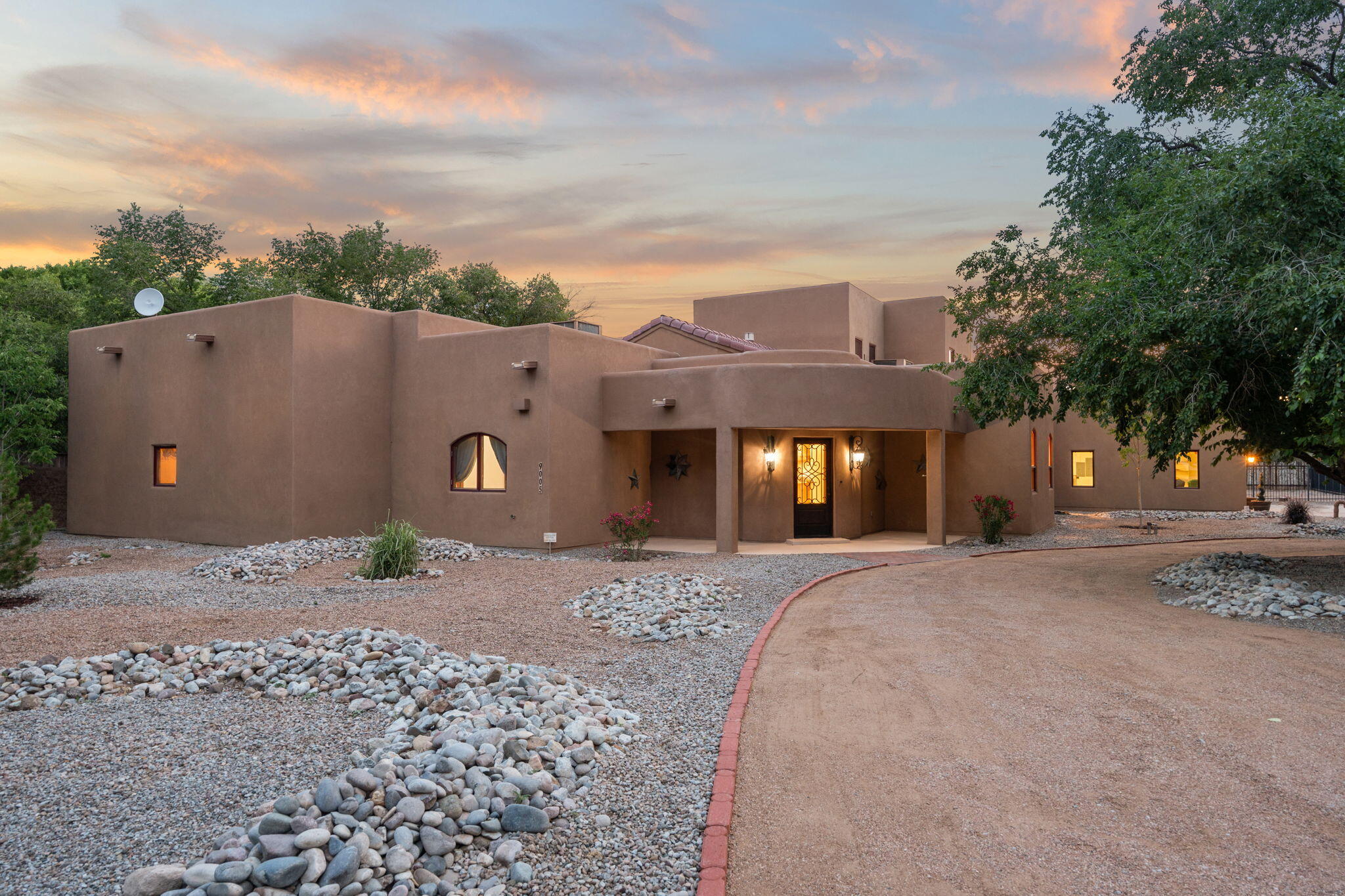 Tucked away on over an acre with no HOA, this beautifully updated home features refinished floors, fresh paint, and designer lighting. Grand living room with soaring ceilings flows into a country kitchen with Viking stove and opens to a serene courtyard with covered patio, outdoor kitchen, pool, and hot tub. Private primary suite with two closets and bonus room. Separate wing includes office, media room, and two bedrooms with full bath. The service room has a huge amount of storage, complete with built in desk. This property is situated on just over an acre with no HOA, there's plenty of room for gardens, RV storage, or even a future casita. This is a truly one-of-a-kind home with custom touches throughout.