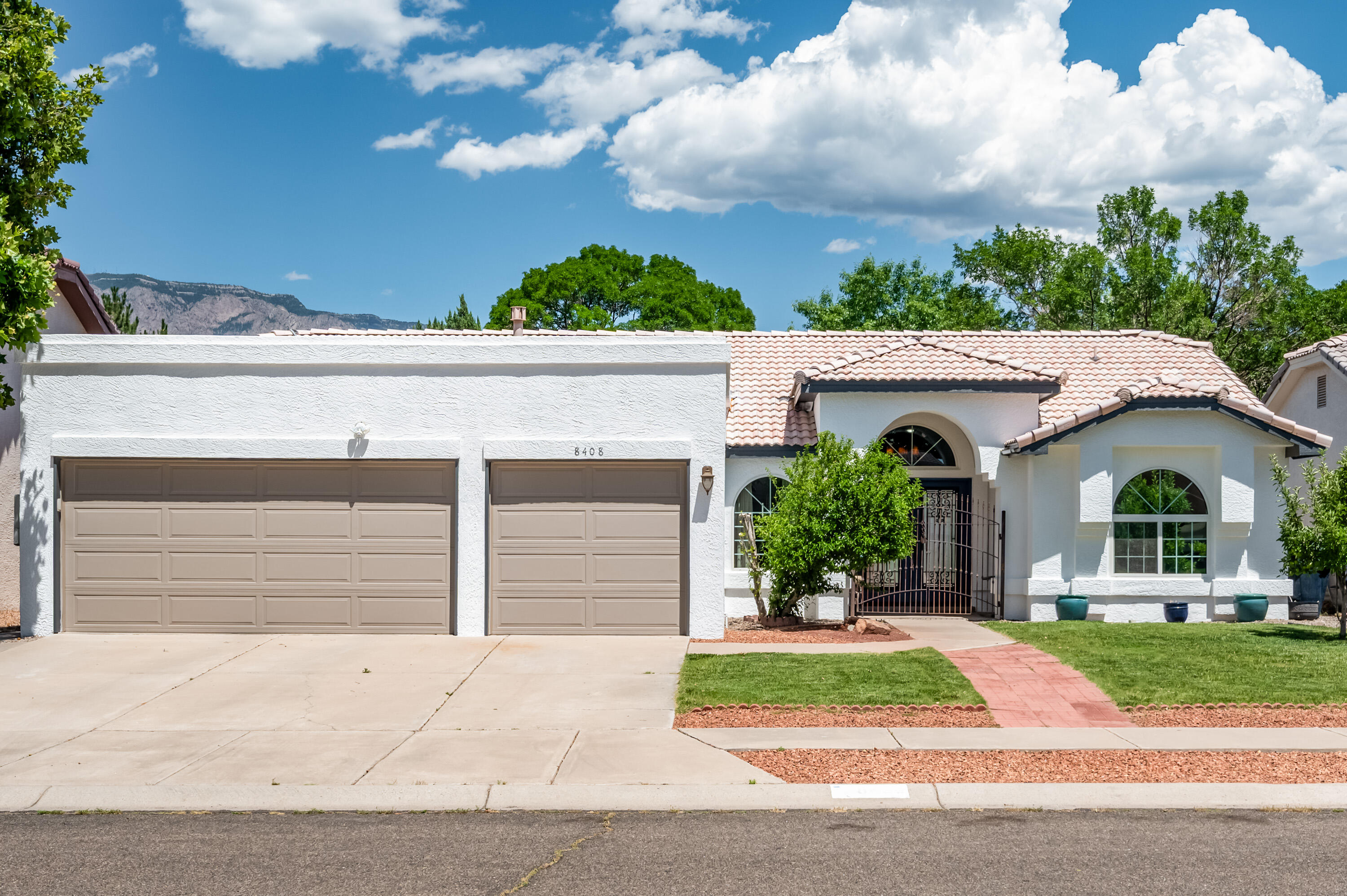 Fabulous single level far North East Heights gem located in sought after La Cueva district! Beautifully appointed w/ fine improvements throughout to include: Updated Luxury Vinyl floors, all Windows with solar glass, includes 2 glass patio doors & double front entry doors replaced. Remodeled full hall bathroom! Charming antique front entry gate welcomes you! Discover a formal dining room & generous great room enhanced w/raised ceiling, decorative fireplace w/gas light. Deluxe kitchen featuring stunning granite countertops, decorative tile backsplash, under cabinet lighting, stainless steel appliances & center island w/bar seating! Separated master suite is a true retreat with sliding door opening to the beautiful backyard! Peaceful & private backyard w/ covered patio, gazebo & turf! MORE!