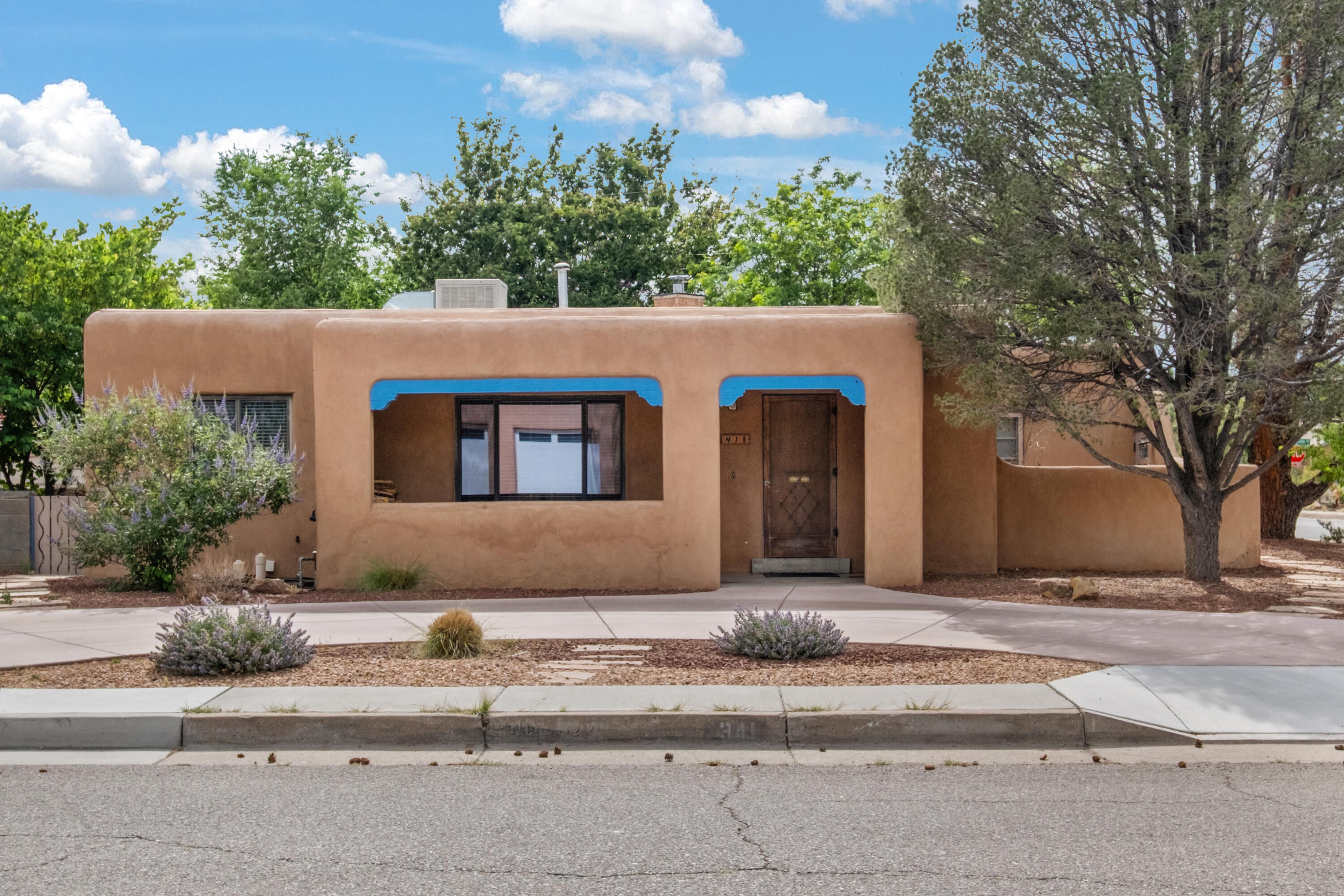 Delightful 1950 Pueblo style  home in the historic Broadmoor district of Nob Hill! This enchanting  property is a rare blend of timeless charm and modern comfort.Paid off solar! Recently upgraded electrical system in 2018, replaced ALL plumbing in 2022, and new TPO roof in 2022 with added insulation and a transferable warranty for peace of mind. Original hardwood floors and authentic finishes that tell stories of the past, & thoughtful upgrades throughout. it's the kind of place that feels like home the moment one comes inside. 4 bedrooms, 1.5 baths with an eat in kitchen that has loads of stoage and a custom built in hutch. Explore Nob Hill just blocks from restaurants, cafes and shops, or stay put and retreat into a little haven of fruit trees & garden beds overflowing with potential