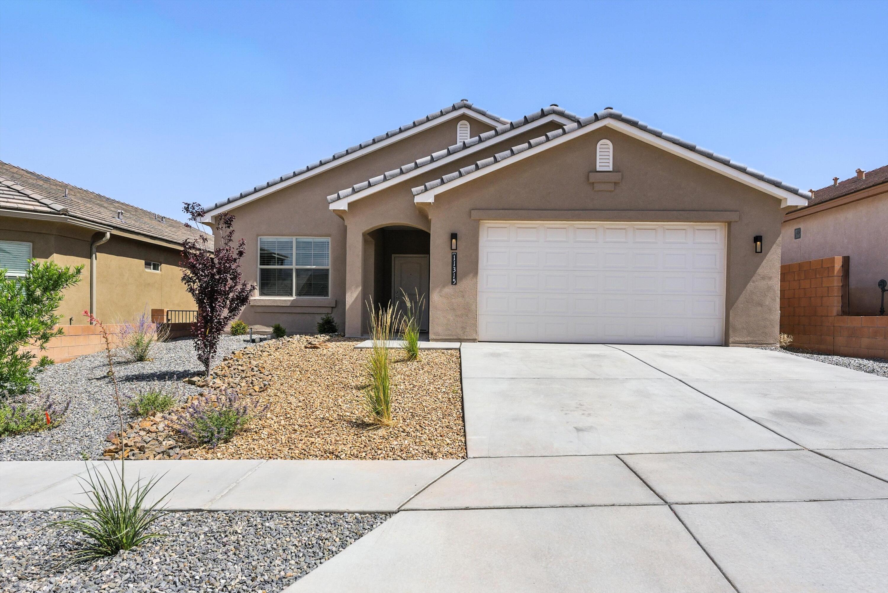 WELCOME TO 11315 RUNNING BEAR--WHERE MODERN COMFORT MEETS CONVENIENT LIVING IN ALBUQUERQUE'S THRIVING SE HEIGHTS. Step inside this Twilight Home and feel the warmth of the custom fireplace, the ease of open concept living, and the flow of a kitchen built for connection--with a large island, soft tones, and a walk-in pantry. Four spacious bedrooms include a tranquil owner's suite with double sinks, walk-in closet, and tiled shower. Enjoy low-maintenance outdoor living on the covered patio in your private, walled backyard. Just minutes from shopping, restaurants, parks, and schools. Come see why this move-in ready beauty won't last! Make your appointment for a private showing today!