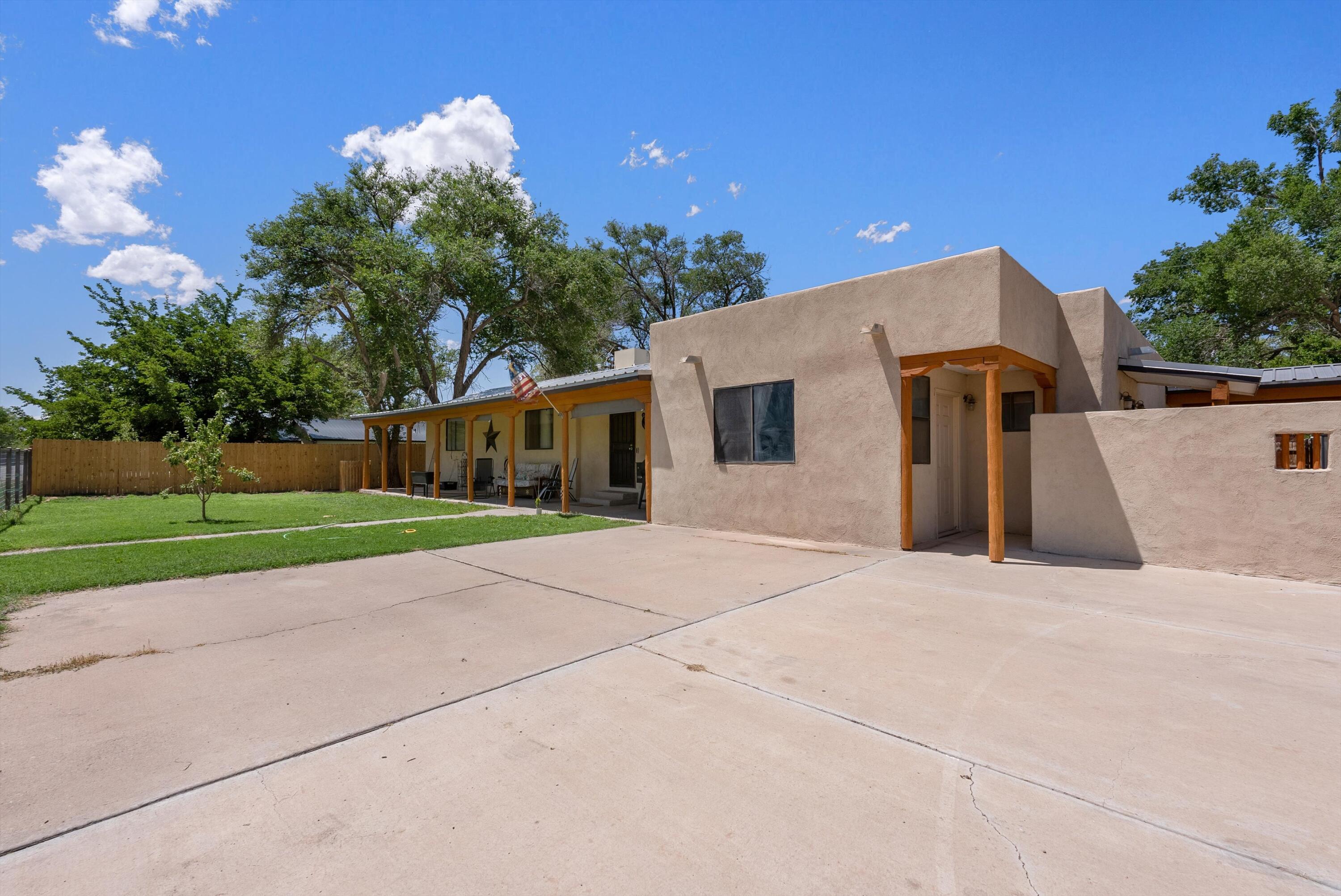 You won't want to miss this property with a multitude of dreams, ready to be fulfilled! This beautiful home sits on half an acre in the beautiful South Valley, with possible 6 bedrooms. This home has been loved, with many upgrades. Featuring new paint in and out, new fencing, re-stuccoed, new washer and dryer, refinished and sealed exterior wood accents, newly planted fruit trees, flooring, bathroom shower and walls, water filtration system, dishwasher, stove, ceiling fans, and more! Fully fenced for animals, basketball hoop, and 3 car garage for toys, or your hobbies/crafts. Come and see, book your showing today!