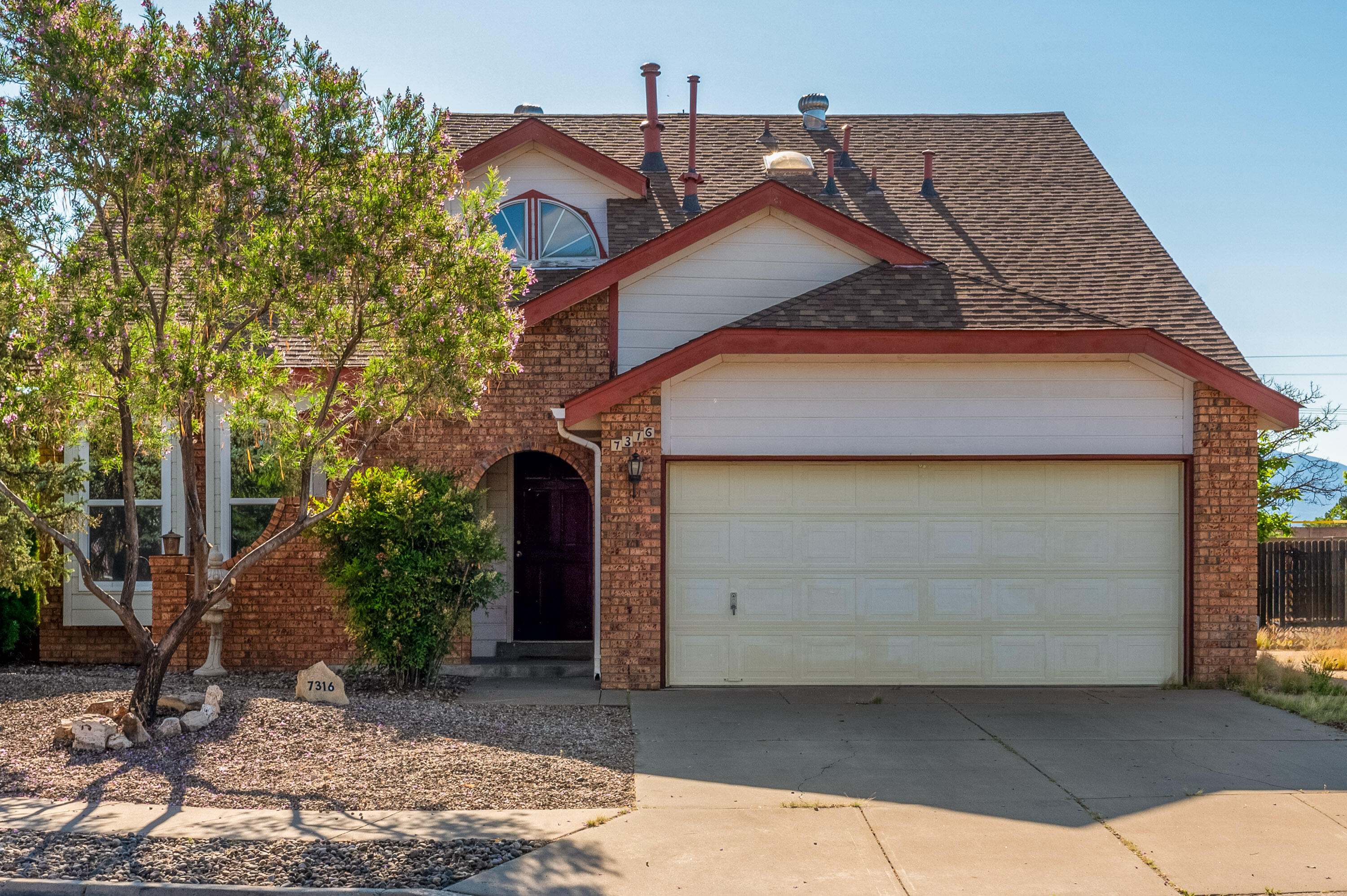 Charming two-story home on Albuquerque's westside with 3 bedrooms and 2.5 baths. The primary suite is downstairs and features a cozy two-way fireplace, jetted tub and separate shower. Upstairs you will find a loft with a wet bar and balcony, bedroom 2 offers built in shelves, bedroom 3 includes built-in shelves and a Murphy bed that will convey. Enjoy year-round comfort with refrigerated air. The refrigerator, washer and dryer all convey, making this move-in ready gem perfect for its next owners! The  home is also just minutes away from Flix brewhouse, groceries, restaurants, etc!