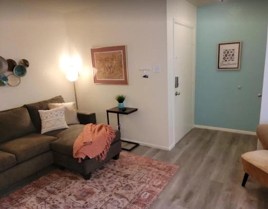 Cosy,  remodeled top floor corner unit at Carlisle Condominiums. Private balcony, updated kitchen and bathroom, laminate flooring, ample storage and central air conditioning/ heat. Additional security, including ADT alarm system and front door security gate. Deeded off street parking.