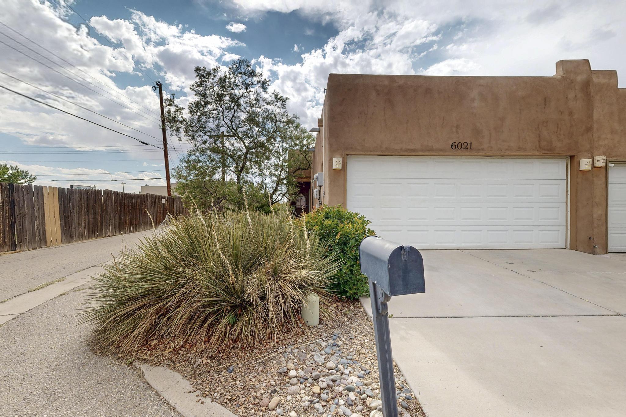 Discover timeless New Mexican charm in this beautifully maintained 2-bedroom, 2 bath townhome with classic Southwestern features and modern upgrades. From the warm kiva-style gas fireplace to the rustic beamed ceilings, and stained glass windows - every detail invites comfort and character. Recent improvements include a new roof (2022) and new HVAC system (2022)--giving you peace of mind and energy efficiency for years to come. The layout is perfect for everyday living or entertaining, with spacious bedrooms, full baths, and cozy living space filled with natural light. Just a stones throw to a grocery store, gym, restaurants, parks and more! This home combines location, charm, and upgrades -- all in one great package.