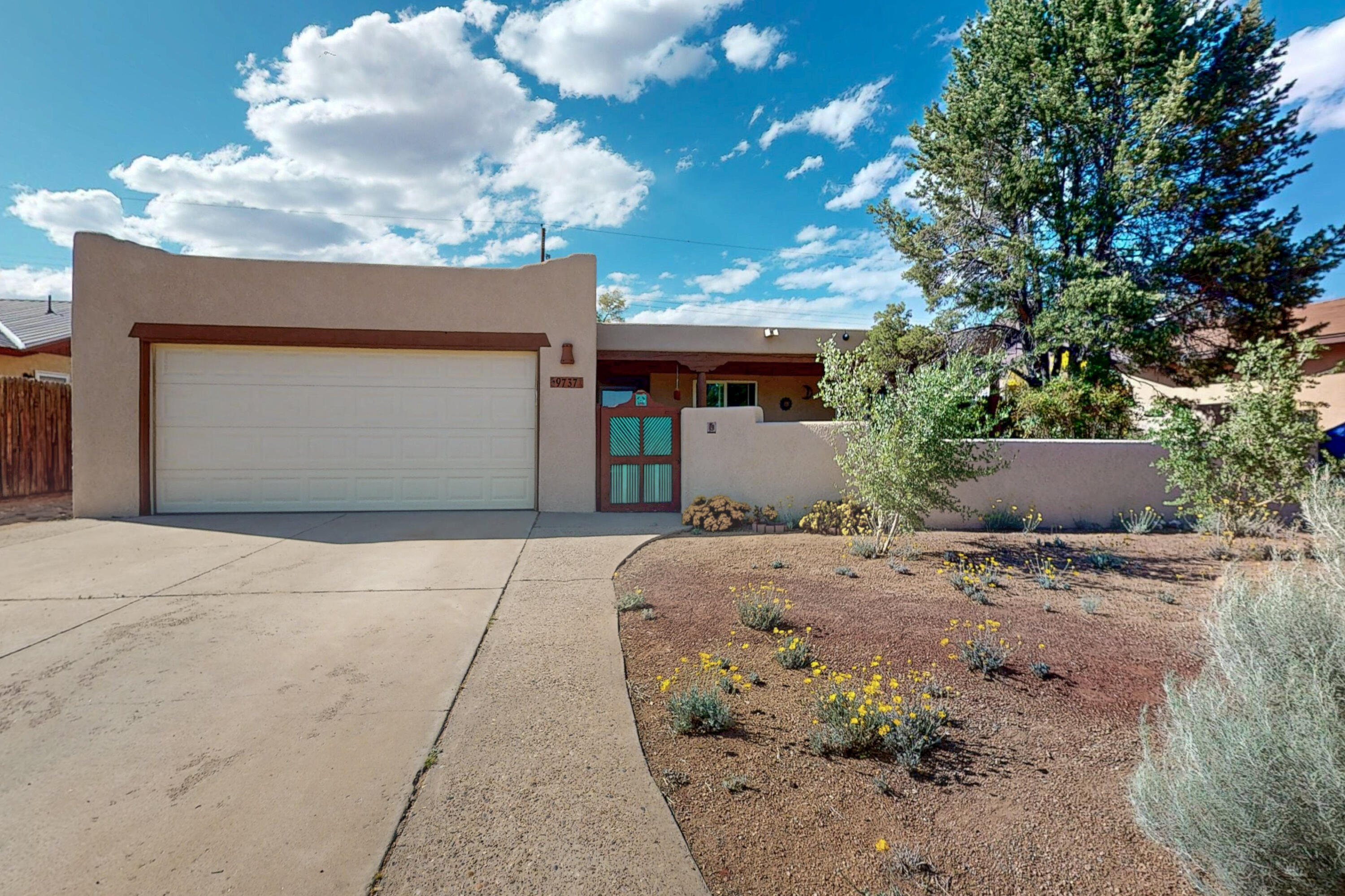 TODAY'S OPEN HOUSE CANCELLED! House is under contract!  Delight in this beautiful & cozy Southwest style property!! This home accommodates a comfortable and relaxed lifestyle. House has been well taken care of with upgrades done throughout the years such as a new remodeled bathroom with barn door in the main bedroom, tankless water heater, A/C conversion & professional maintenance given to roof, furnace & A/C systems. The living space features a custom fireplace that exudes charm and warmth. The kitchen blends functionality with fairly new appliances, solid maple cabinets and granite counter tops. Outside, enjoy the serene landscaped backyard that mirrors the western scenery.This home gives a feeling of warmth, tranquility, and oneness with the surrounding natural landscape!