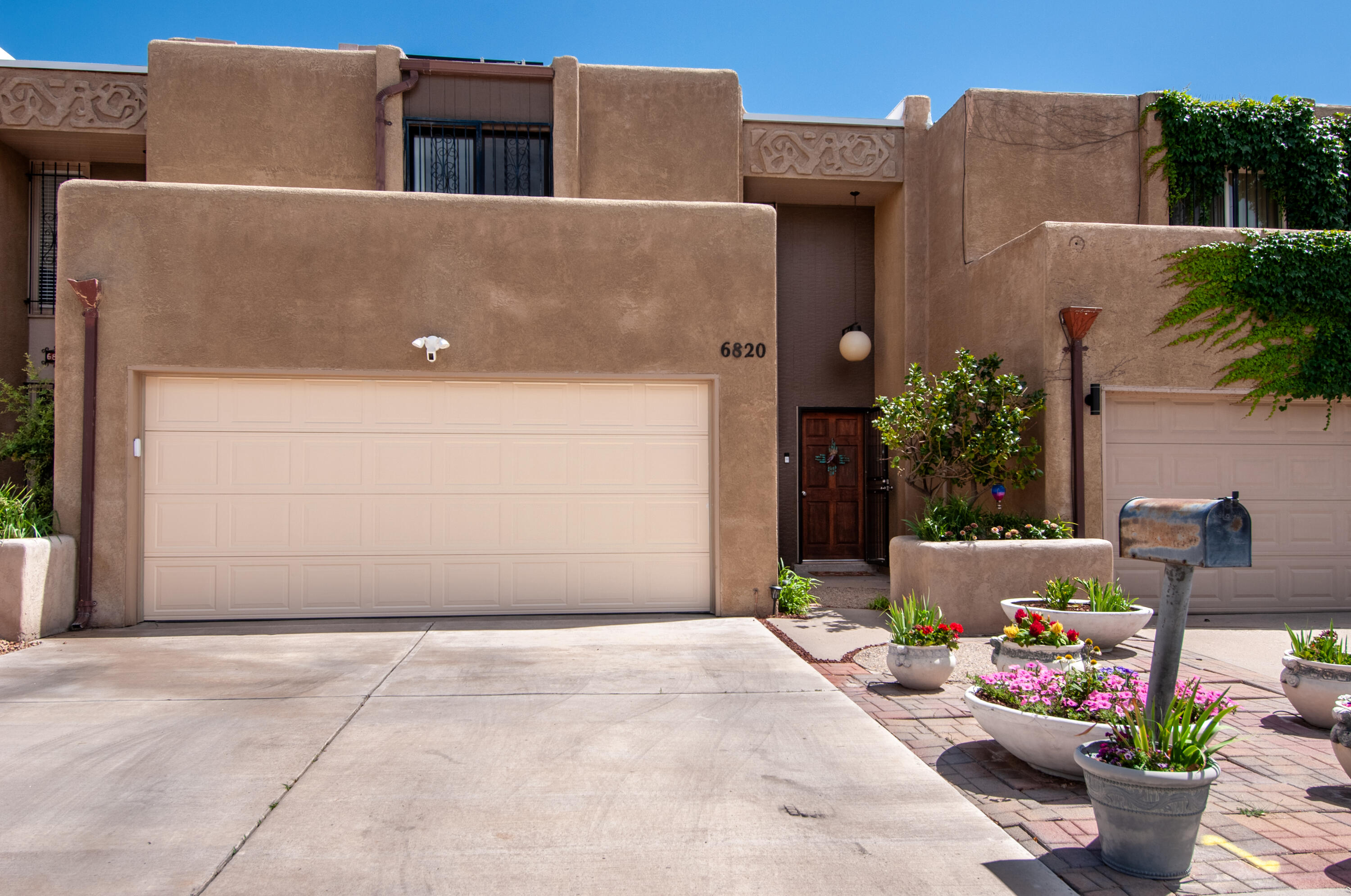Relax as soon as you walk in because there are no projects!  OR it's hot, so head to your gated HOA pool. Every room has updates...from the wood-grain tile floors to the contemporary kitchen.   Bright, welcoming entry to great room with lovely accent fireplace.   Updated white cabinets with granite counterops, stainless appliances.  So much storage.  3-panel slider to the covered party patio.  Easy care backyard with enough green, not too much!  Upstairs is the primary, again so many updates!  Soaker tub, large tiled shower, double sinks.  Huge walk-in closet!  Other 2 bedrooms are roomy as well, and guest bath is also renovated.  And that's just the inside!   TPO roof, paid-for solar.  2-car garage.  And close to I25, Monroe's, shopping, groceries!  Quiet and cool. Does not get​​‌​​​​‌​​‌‌​‌‌‌​​‌‌​‌‌‌​​‌‌​‌‌‌ better!