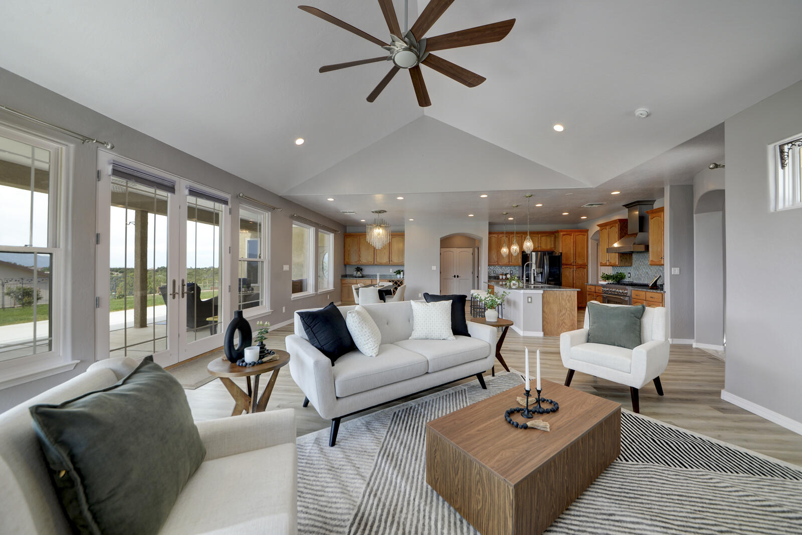 Introducing your East Mountain retreat in the community of Rancho Verde in Tijeras. This custom built luxury home sits on over an acre of land that showcases breathtaking views of the Sandia and Manzano Mountains. Expansive Anderson windows frame the beautiful scenery. A wood burning fireplace equipped with blower is nestled in the corner of an open-concept living area. The chef-caliber kitchen features granite countertops, a 36'' Zline commercial stove, stainless steel appliances, a center island, built-in buffet and generous walk-in pantry. The primary suite sanctuary features a spa-like tandem shower, seperate soaking tub, double sinks and roomy WIC. Covered patio fitted w/220 outlet for spa/hot tub. Other unique highlights of this mountain charmer are a Lennox heating and cooling